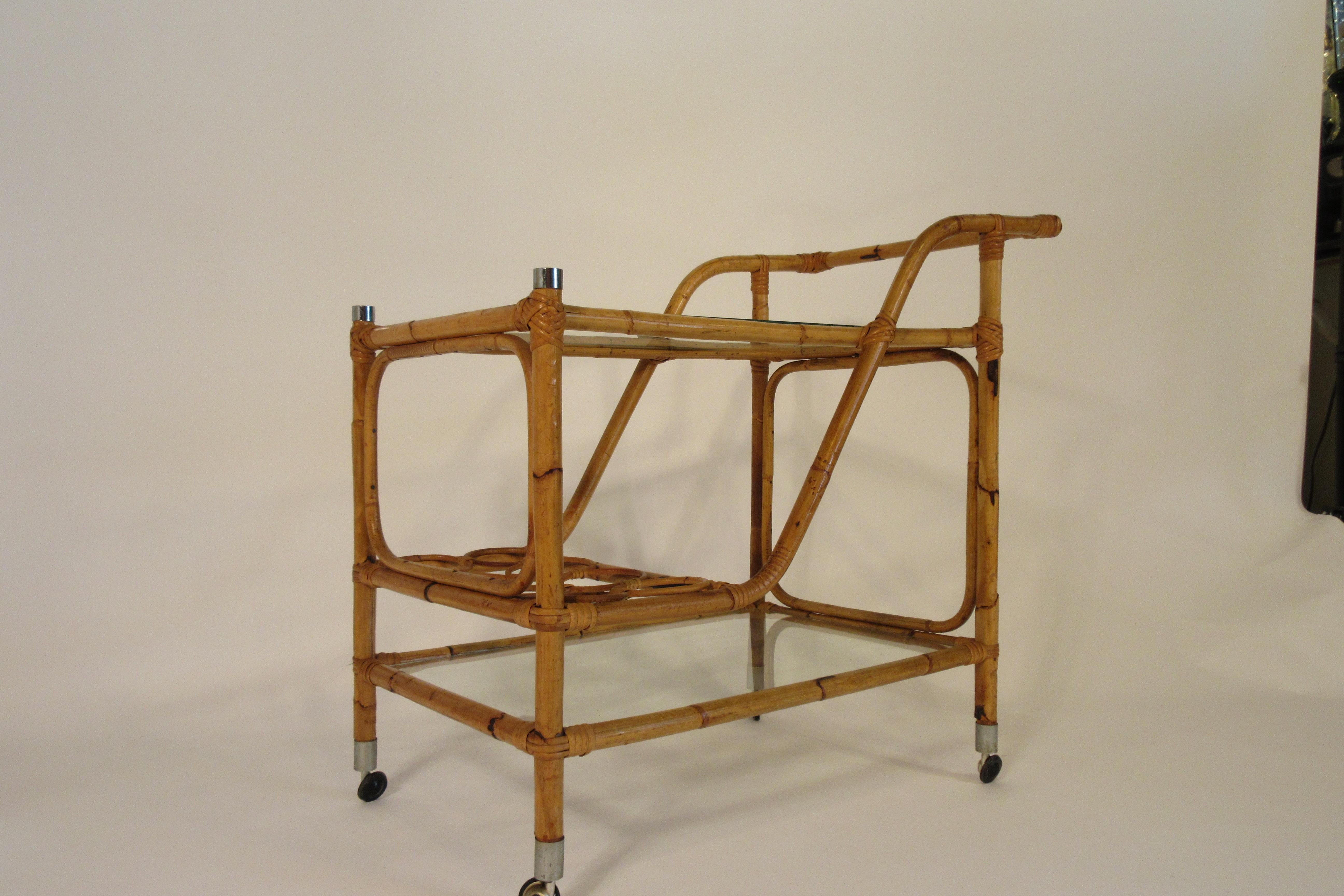 1960s bamboo bar cart. 2 shelves of glass.