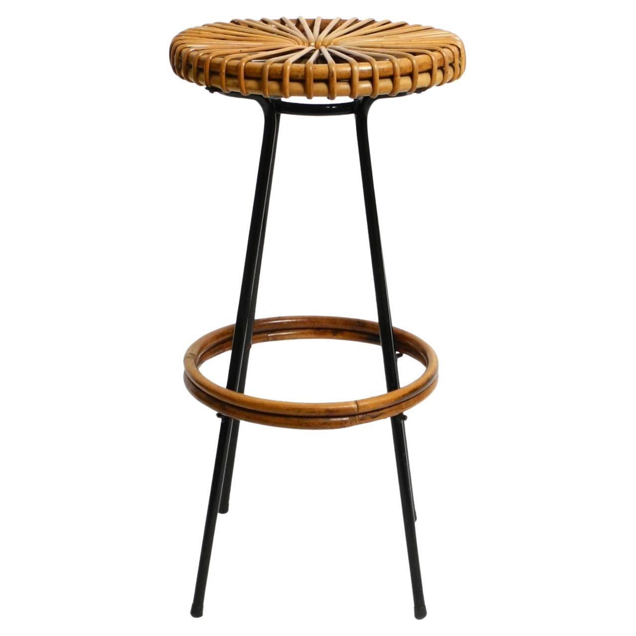 A very beautiful original 1960s bamboo bar stool by Dirk VAN SLIEDREGT.
Manufactured by Rohé Noordwolde. Made in the Netherlands.
Bamboo frame with bamboo seat and bamboo footrest.
Black lacquered metal legs. Very good vintage condition, no