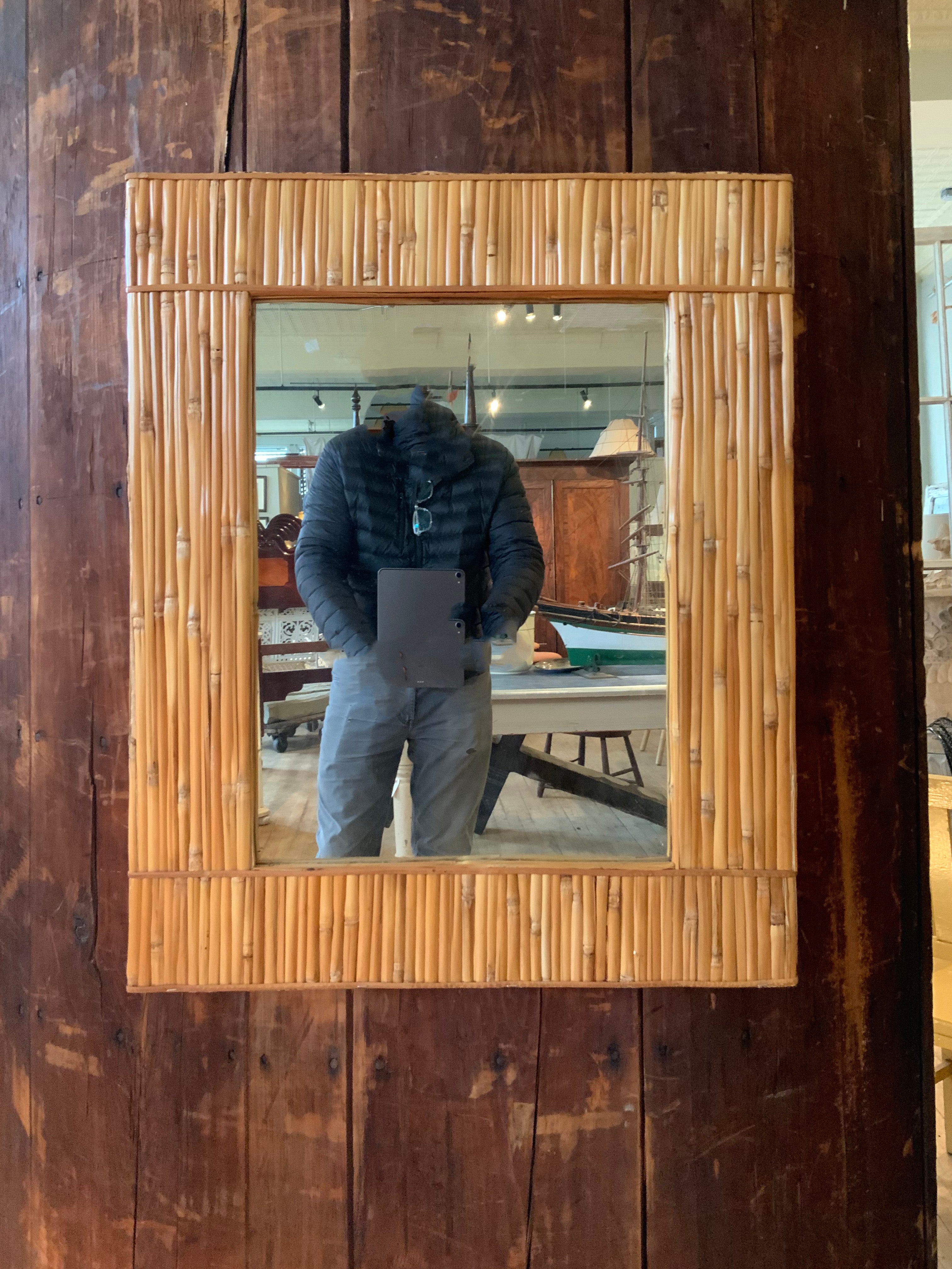 a beautiful and handsome vintage 1960's wall mirror by Raymor, with a wide bamboo border and bamboo detailed edges as well. wonderful scale and details. works well with a wide variety of interiors and styles.