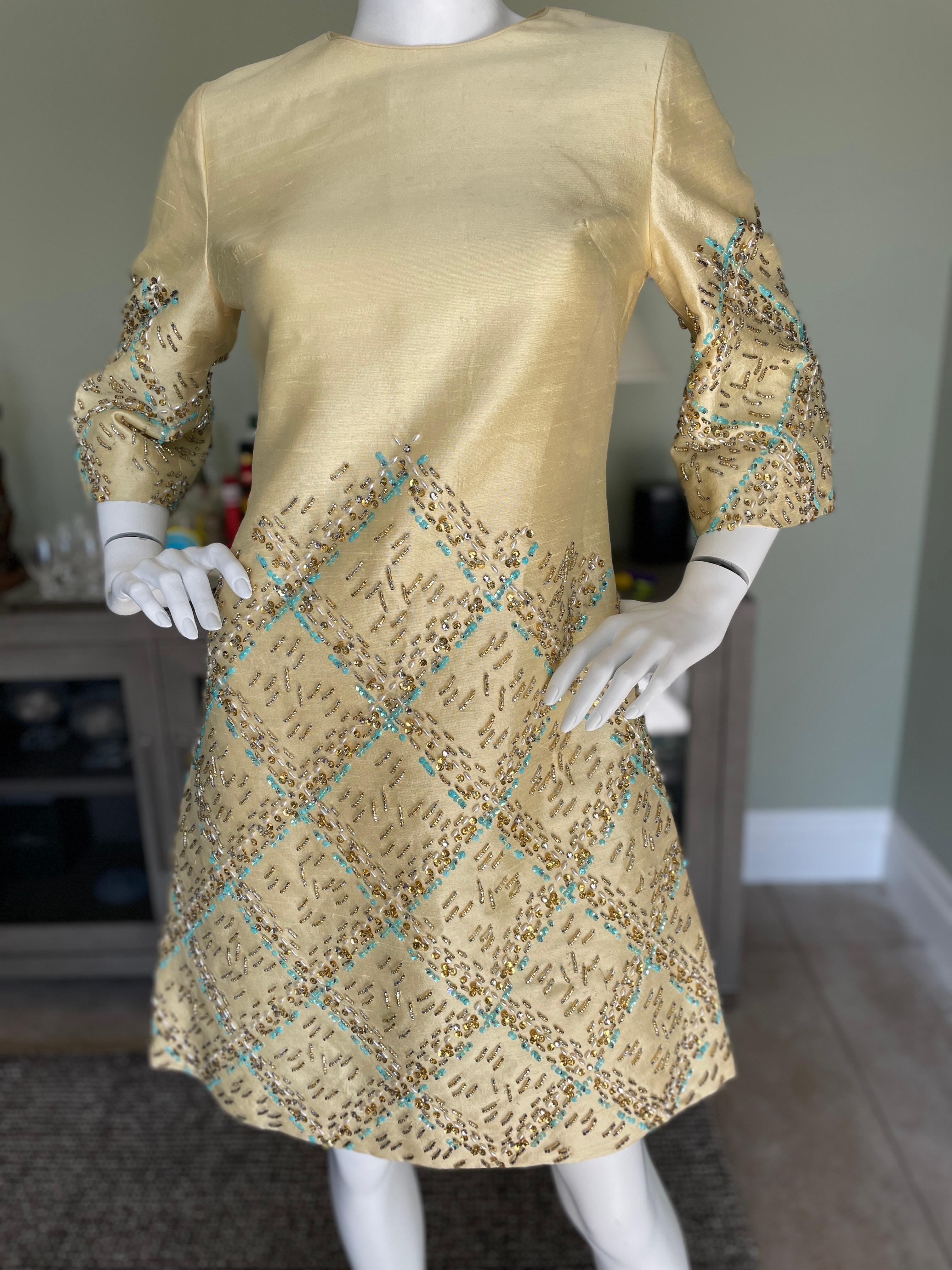 Vintage 1960's Dupioni Silk Cocktail Dress w Turquoise and Topaz Embellishments 
Beautiful bead work on the dupioni silk.
This is so pretty, but runs a bit small for it's size, so please refer to measurements.
Size 10, more like a 6 today
Bust
