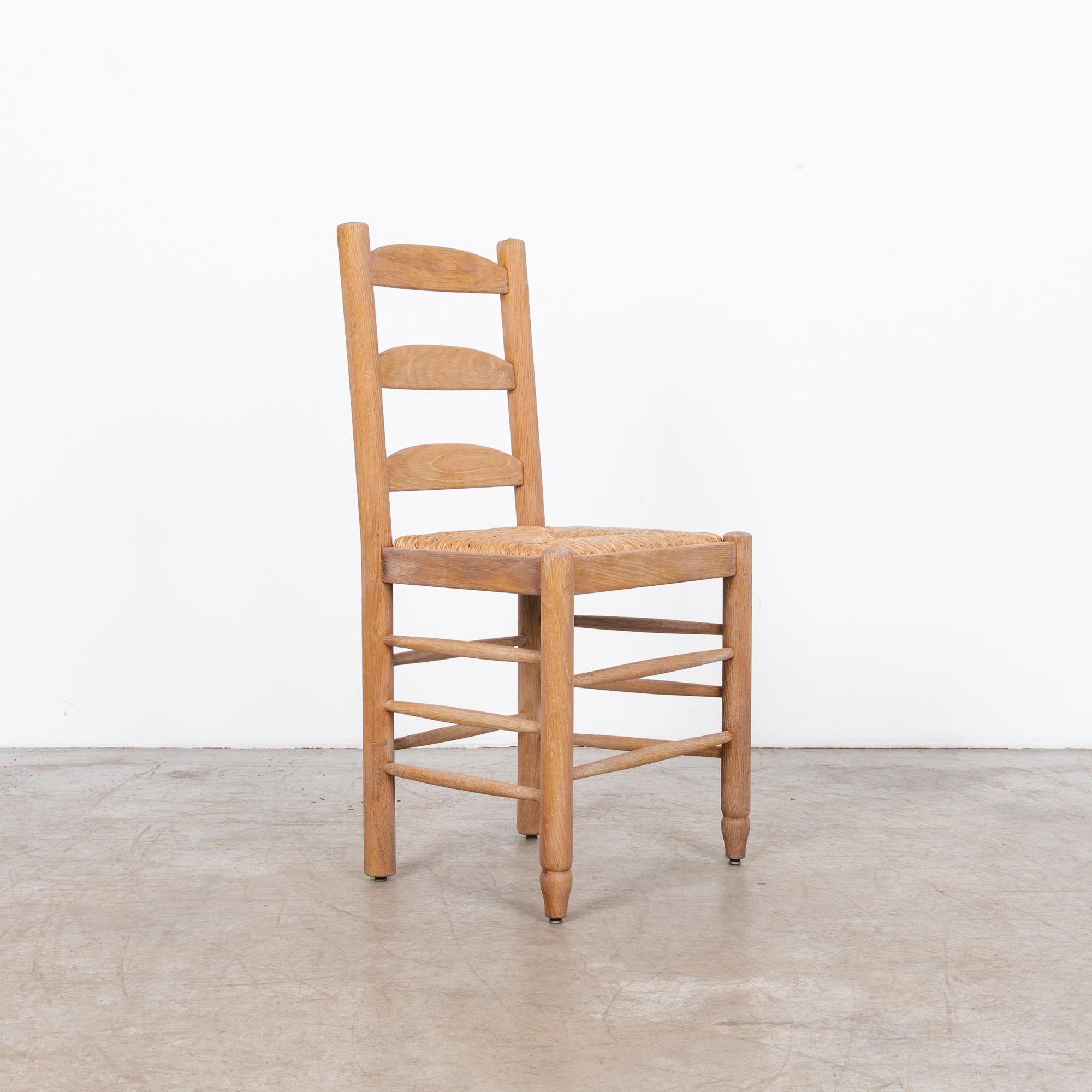In the dynamic design landscape of 1960s Belgium, this bleached oak dining chair epitomizes the blend of functionality and style prevalent during the period. Crafted with meticulous attention to detail, this chair reflects the innovative spirit of