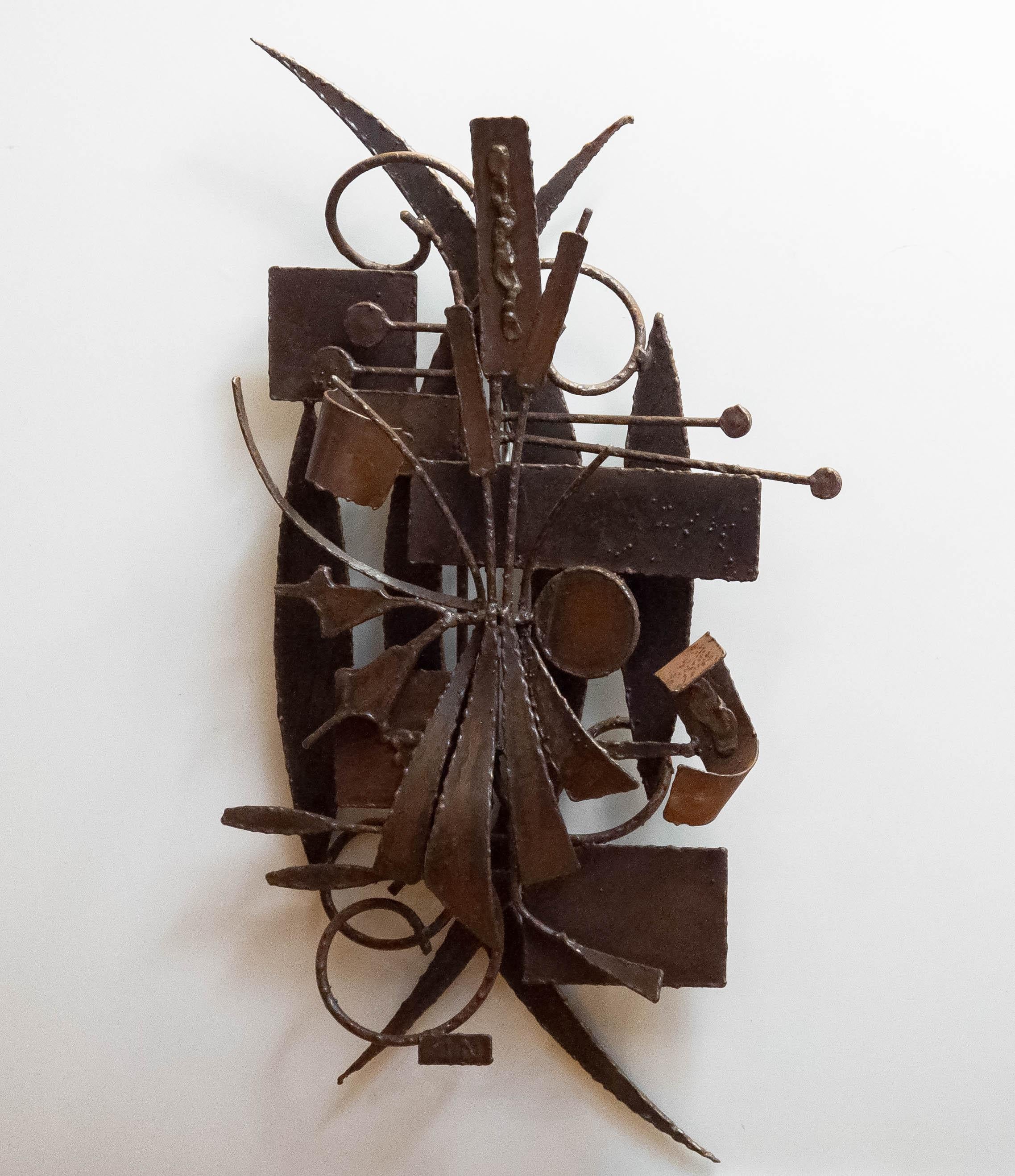 A striking example of mid-century Belgian Brutalist wall art, this piece is expertly welded from metal and boldly abstract in form. Created circa 1960 and signed “J.N.” by the unknown artist, it features an expressive, jagged interplay of metal