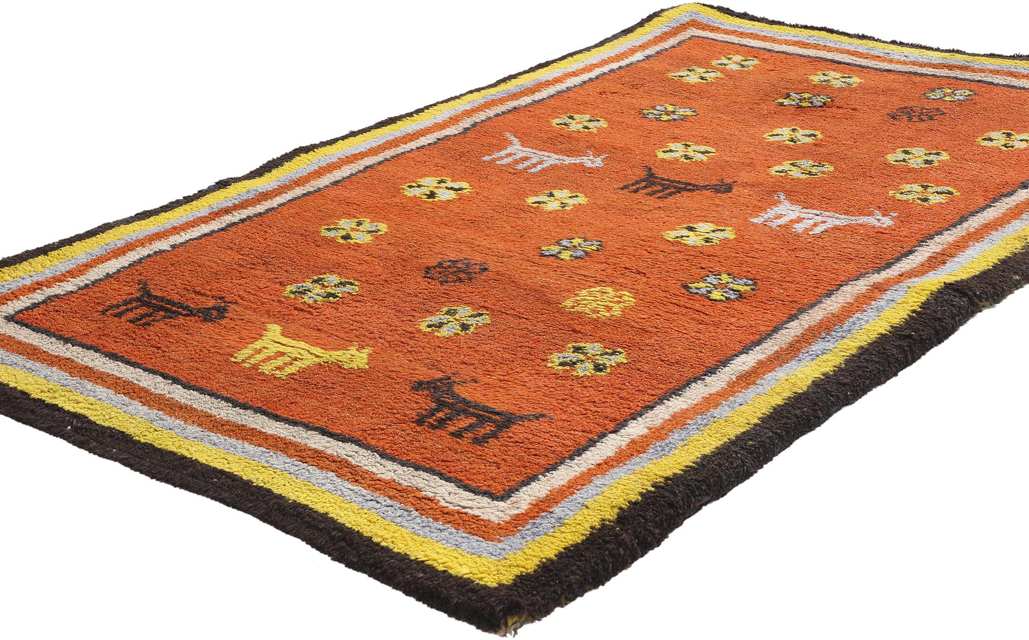 79187 Vintage Tikdift Moroccan Rug, 03'05 x 05'03. A joyful ode to pastoral life and tribal memory, this hand-knotted wool vintage Tikdift Moroccan rug from the Zanagah tribe radiates with folkloric charm and ancestral spirit. Set upon a warm terra