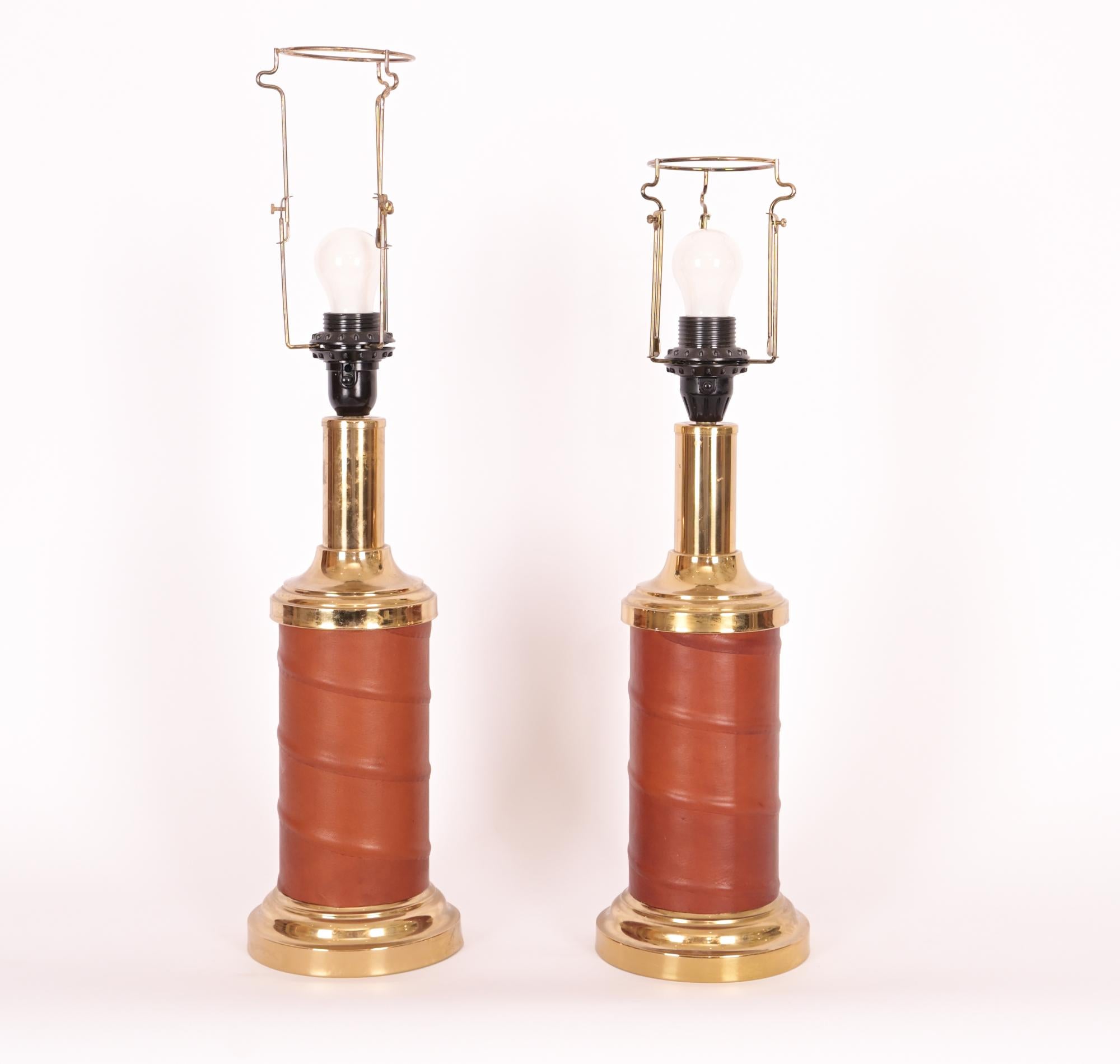 Brass lamps with a deep orche leather wrapping around the center of the base in a downward spiral. Made by the Swedish Lighting and Design Company Bergboms (1940-) with labeling underneath, circa 1960.

Lamp shades not included

Shade rest