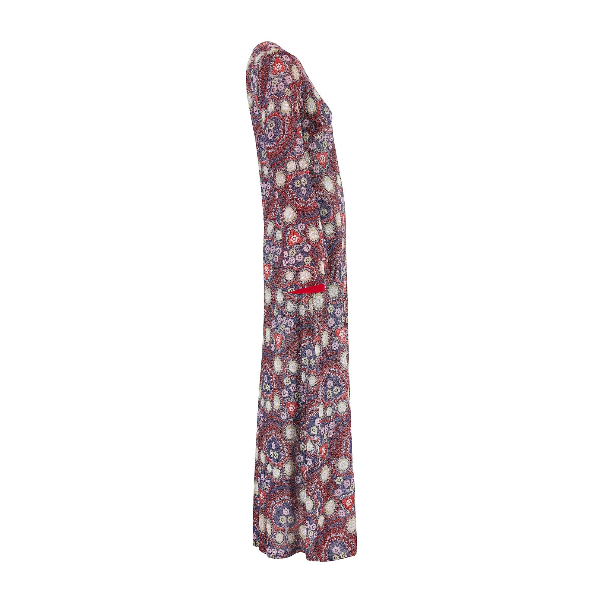 The Parisian answer to the 'flower power' fashions of the late 1960s, this glittering maxi gown was created by Bernard Claverie of Paris circa 1968-1969.  An excellent example of a Parisian boutique adapting haute couture designs for the ready to