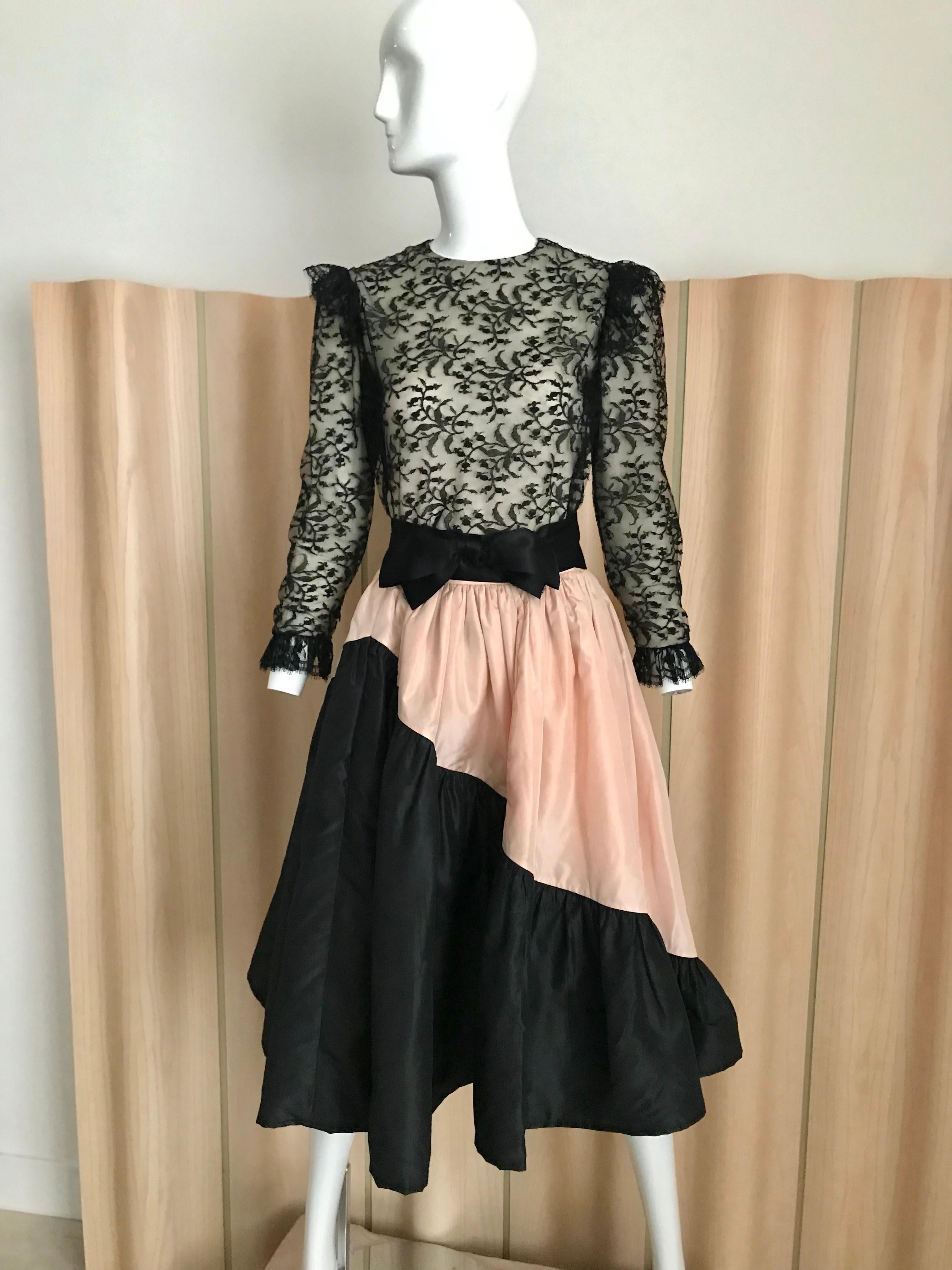 Vintage 60s Bill Blass black lace silk blouse with ruffle on the shoulder.  This two piece comes with  pink and black silk taffeta circle skirt and silk sash bow.  
Blouse is best for petite size. Sleeve is rather shorter than usual.
Bust Blouse: 32