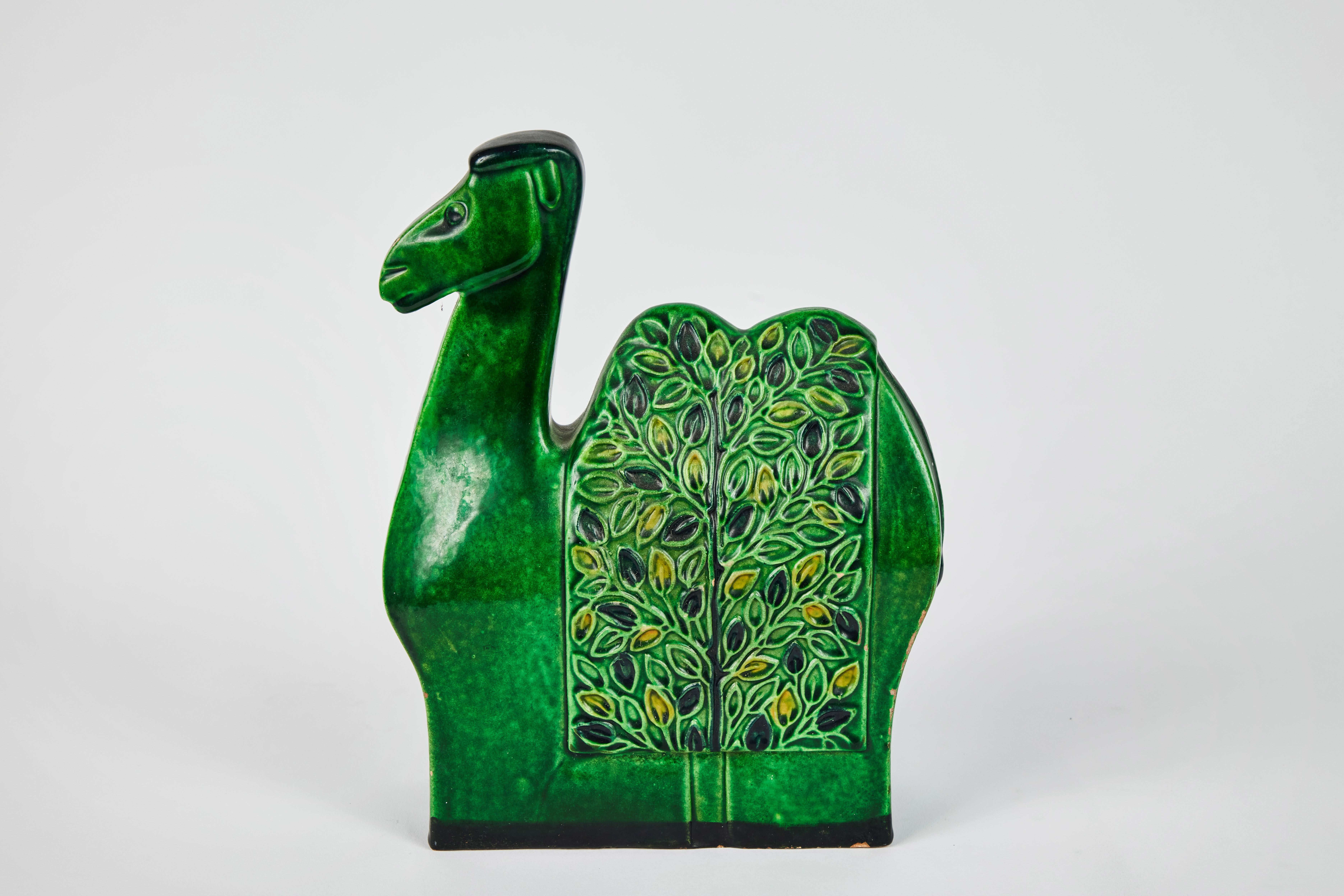 1960s Bitossi camel sculpture by Aldo Londi with Signature. This rare and sculptural Italian ceramic vessel is executed in green glazed ceramic with geometric embossed flower designs. A refined yet whimsical design characteristic of the best Italian
