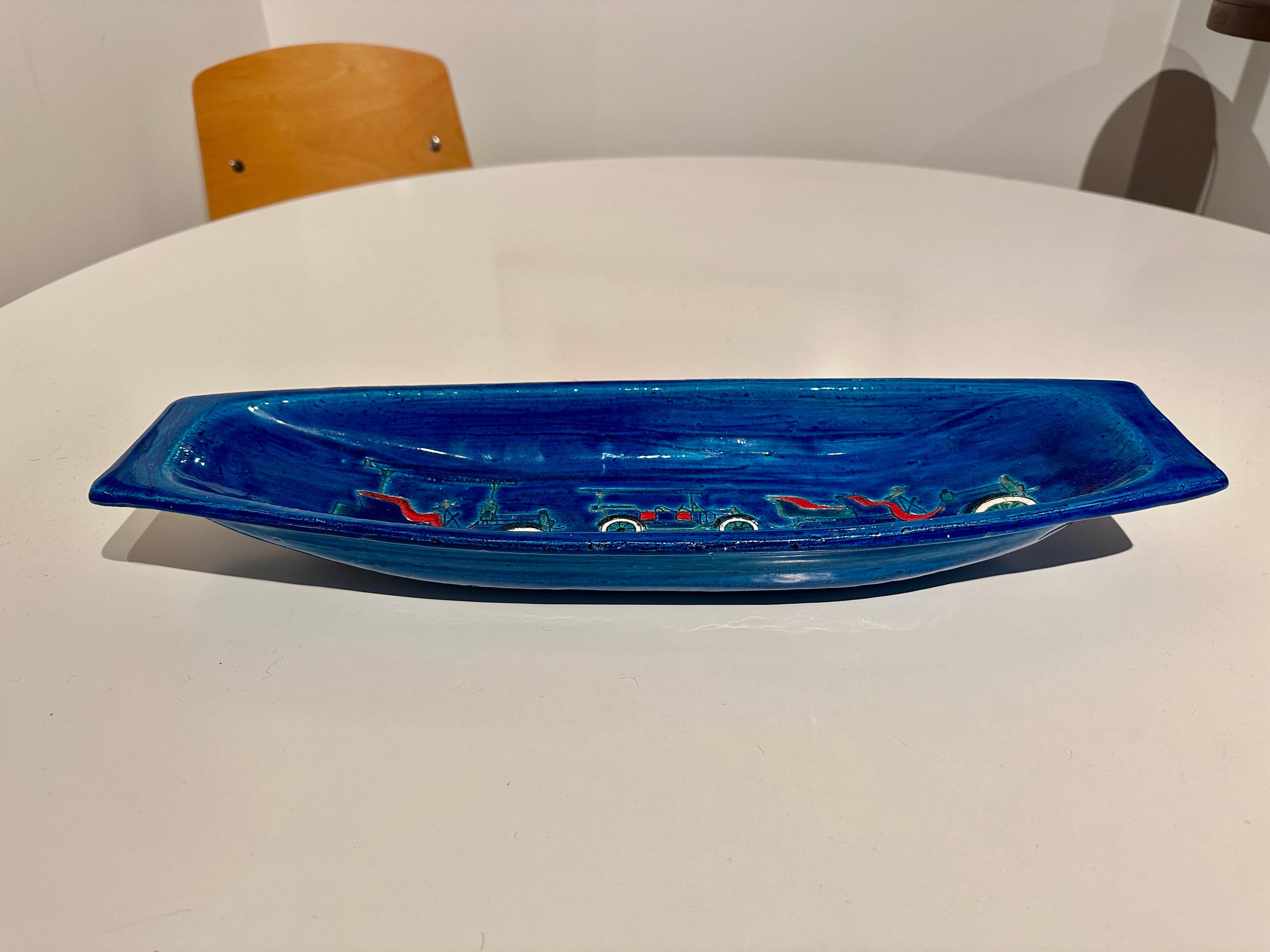 This richly blue long oblong shaped bowl with early automobiles design is a great decorative bowl for foyer table, makeup table, accessory, etc.