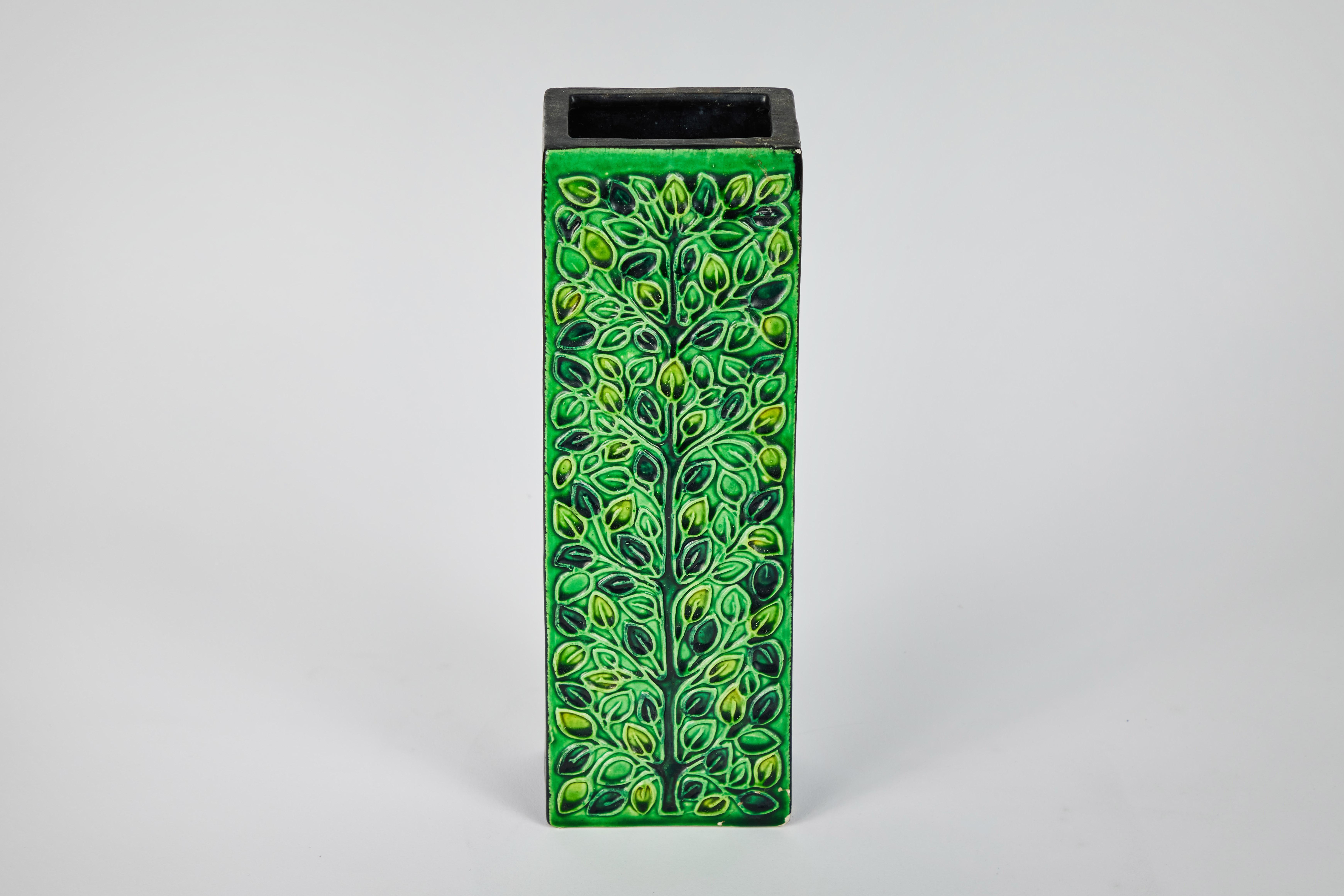 1960s Bitossi rectangular vase by Aldo Londi with Signature. This rare and sculptural Italian ceramic vase is executed in green glazed ceramic with geometric floral embossing, black sides and rim. Signature on bottom of vessel. A refined yet