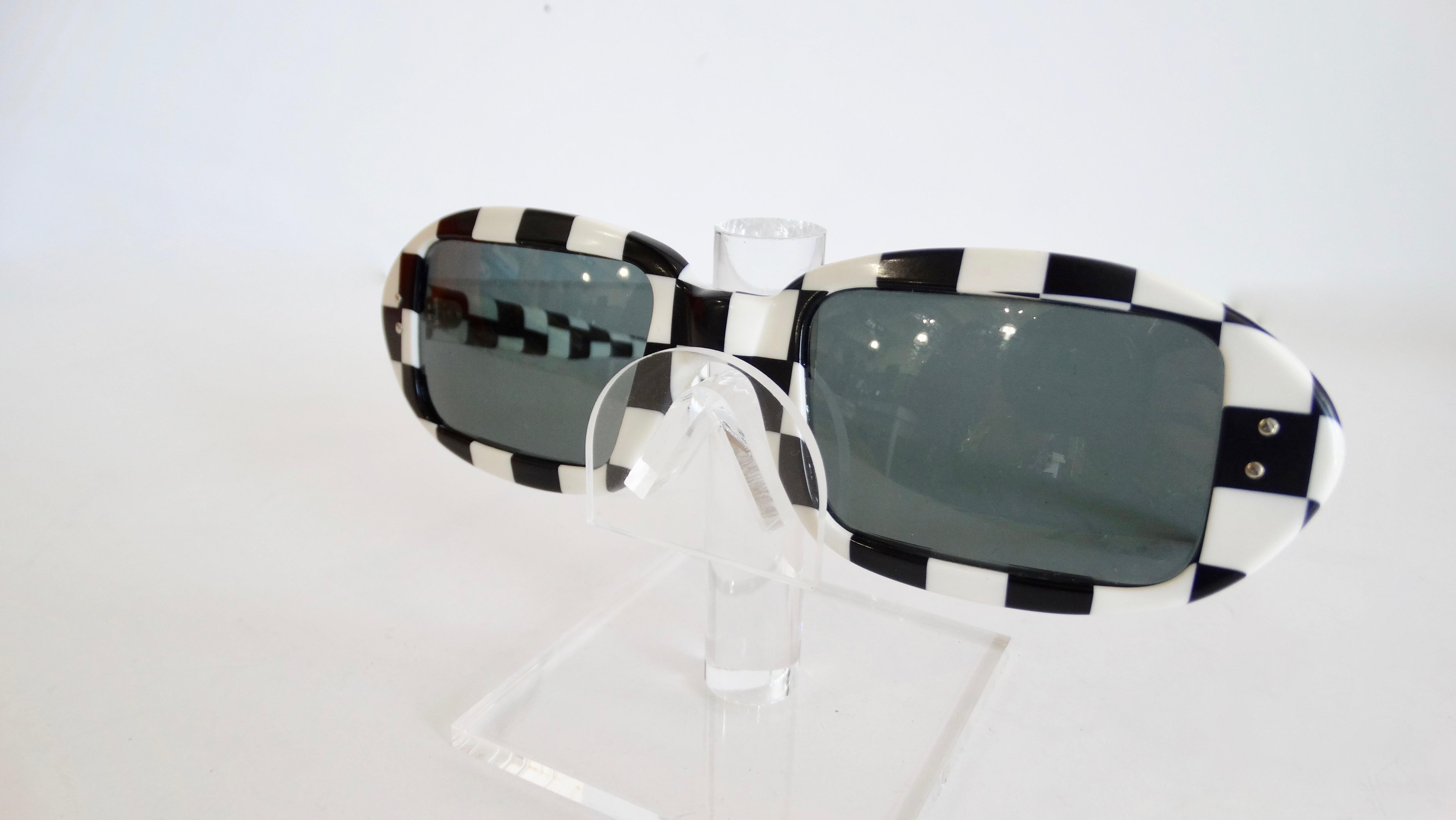 Spice up your sunglasses game with these amazing Mod sunnies! Circa 1960s, these Frame France sunglasses highlight the Mod era and feature a black and white checkered design, rounded rectangular frame, and black lenses. The perfect pair of