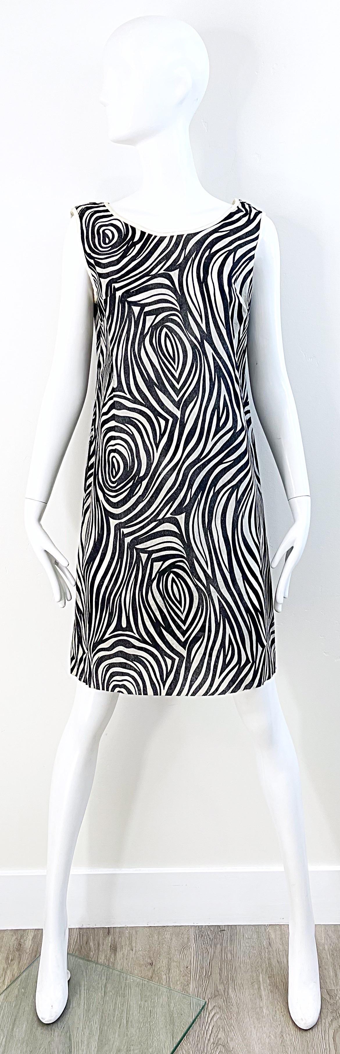 Chic black and white psychedelic zebra animal print mod paper shift dress ! Simply slips over the head. Soft, yet durable paper fabric. Paper dresses were all the rage in the late 60s when the Scott Paper Company introduced them into the fashion