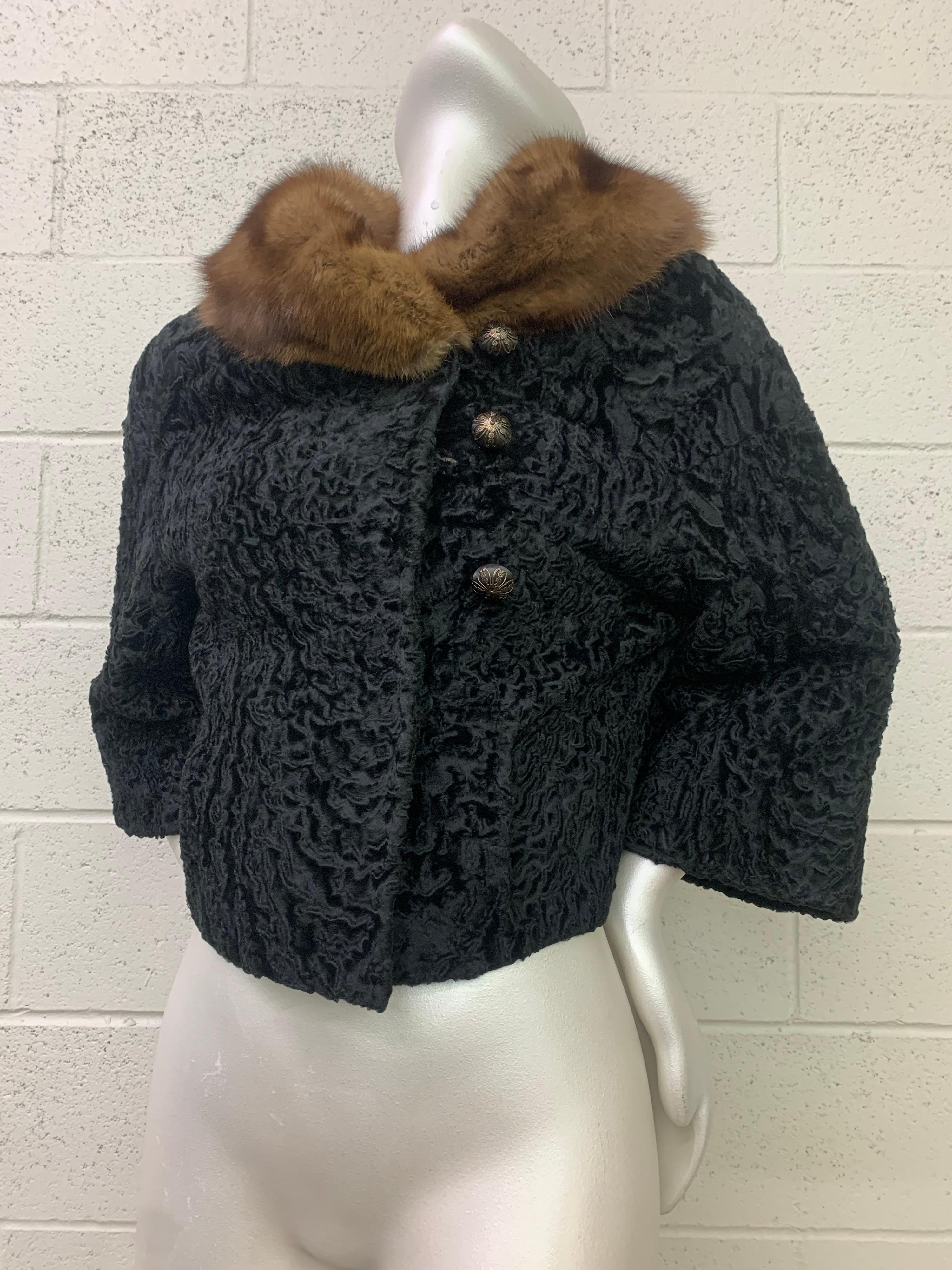 An adorable 1960s cropped black broadtail lamb jacket with a stunning natural sable collar. Bracelet length sleeves and a button-up closure at left side. Completely lined. Size 4-6.