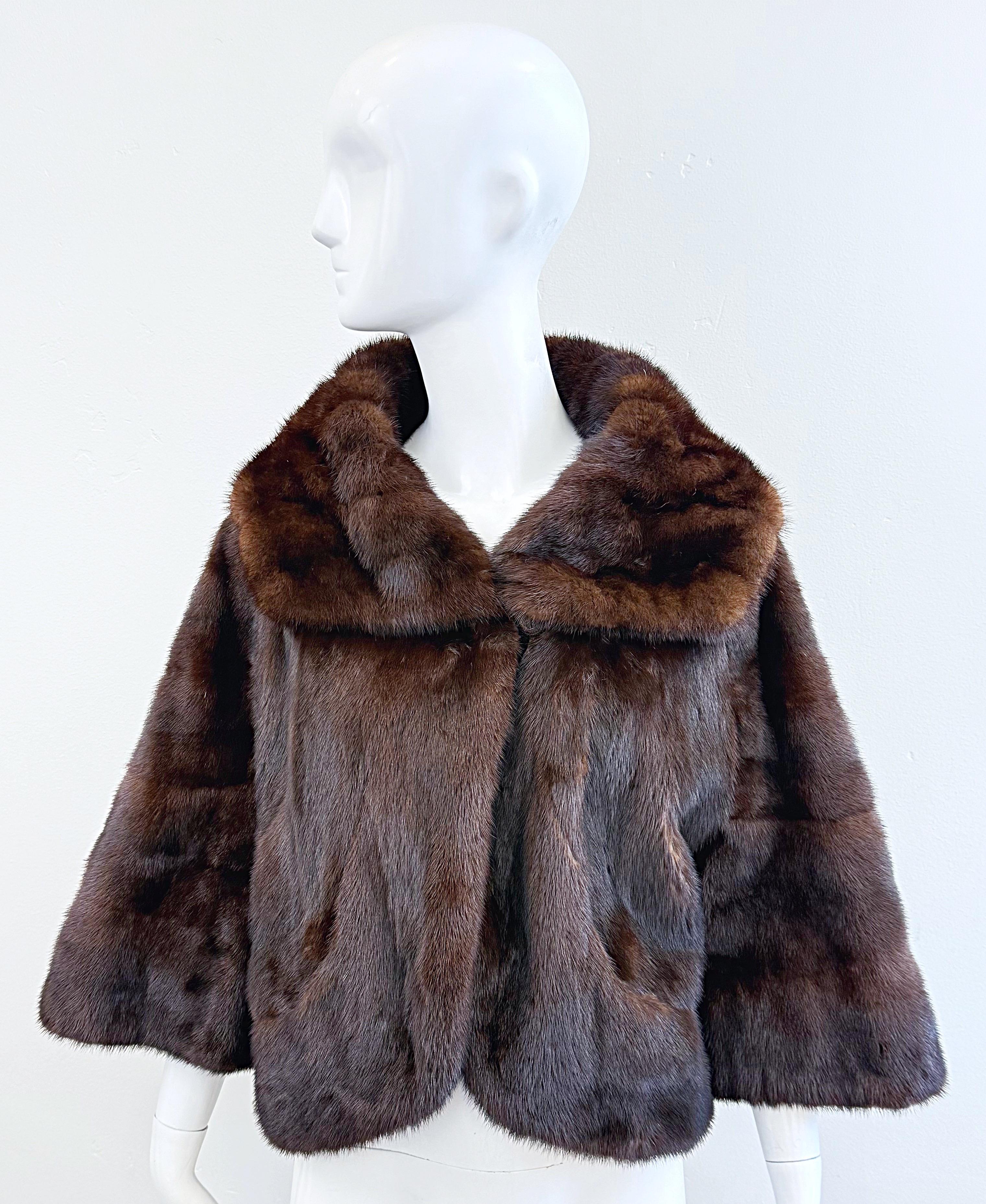 Beautiful luxurious early 60s Black Diamond Mink brown / mahogany fur swing jacket! The most beautiful rich color, with the softest mink. Single closure at center front neck. Pockets at each side of the waist. Super stylish and flattering fit. So