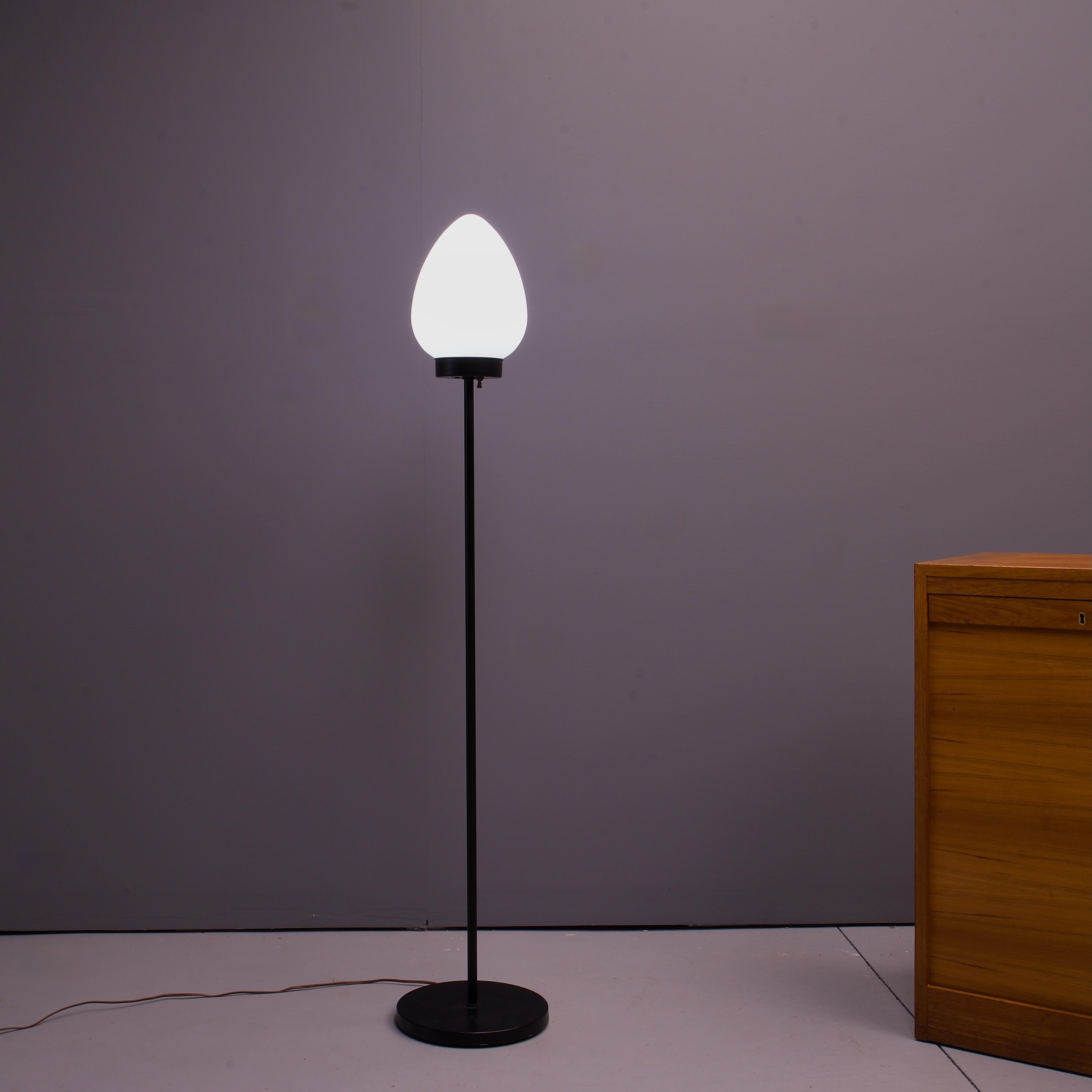 Takes a normal screw in e26 bulb, US electric plug in, and has a three stage brightness switch.  So use a three stage bulb for best results. Attributed design or at least the manufacturing to the Laurel Lamp Company. Small dent to base, pictured. No