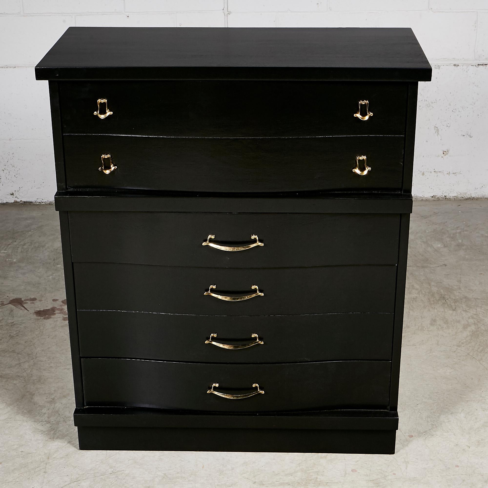 Vintage 1960s black lacquered high boy dresser with four drawers for storage. The metal pulls are in gold and the top drawer is doubled in size. In newly refinished condition. No marks.