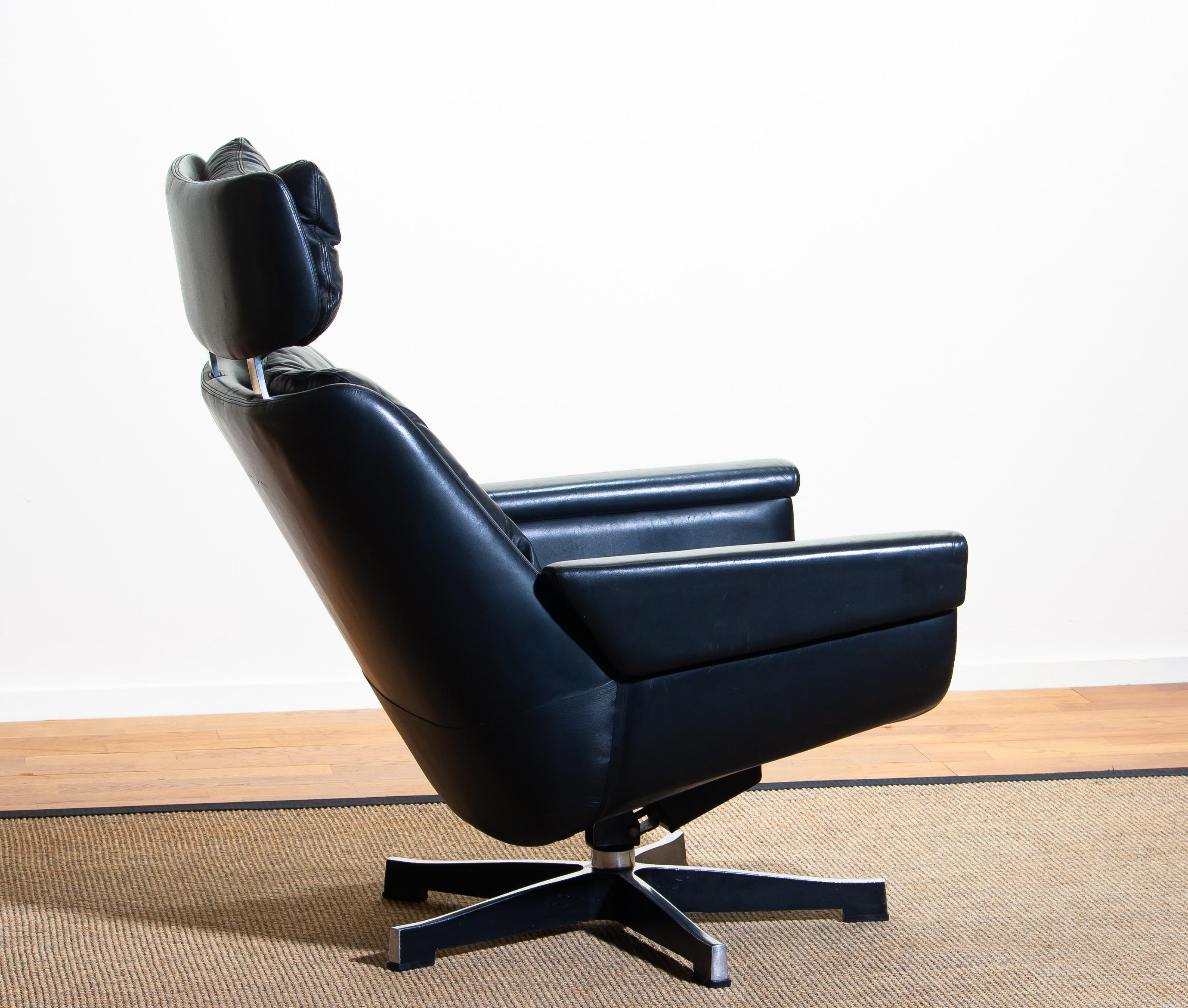 Mid-Century Modern 1960s, Black Leather, Rosario, Swivel Rocking Chair by Kurt Hvitsjö for Isku