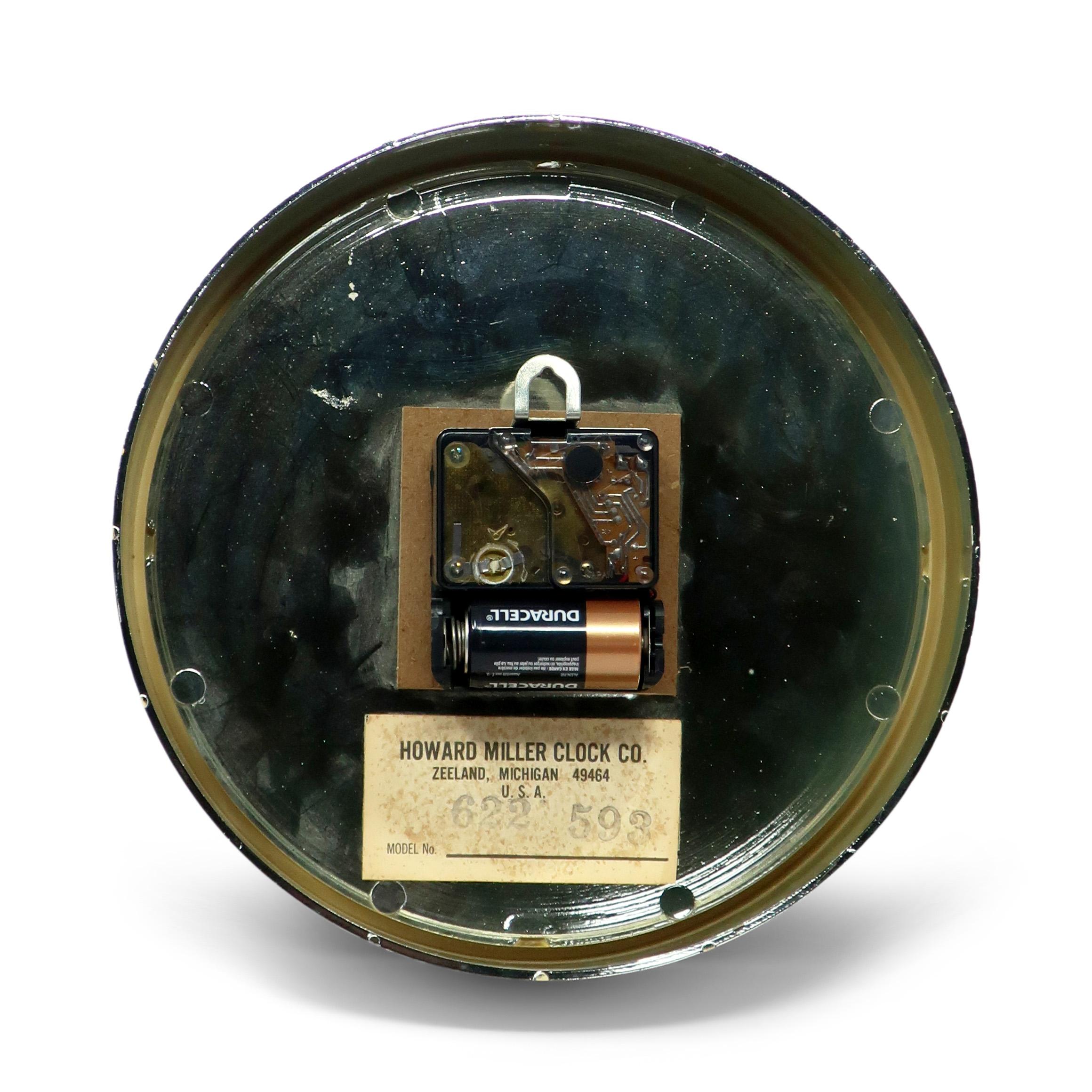 Plastic 1960s Black Mirrored Wall Clock by Howard Miller