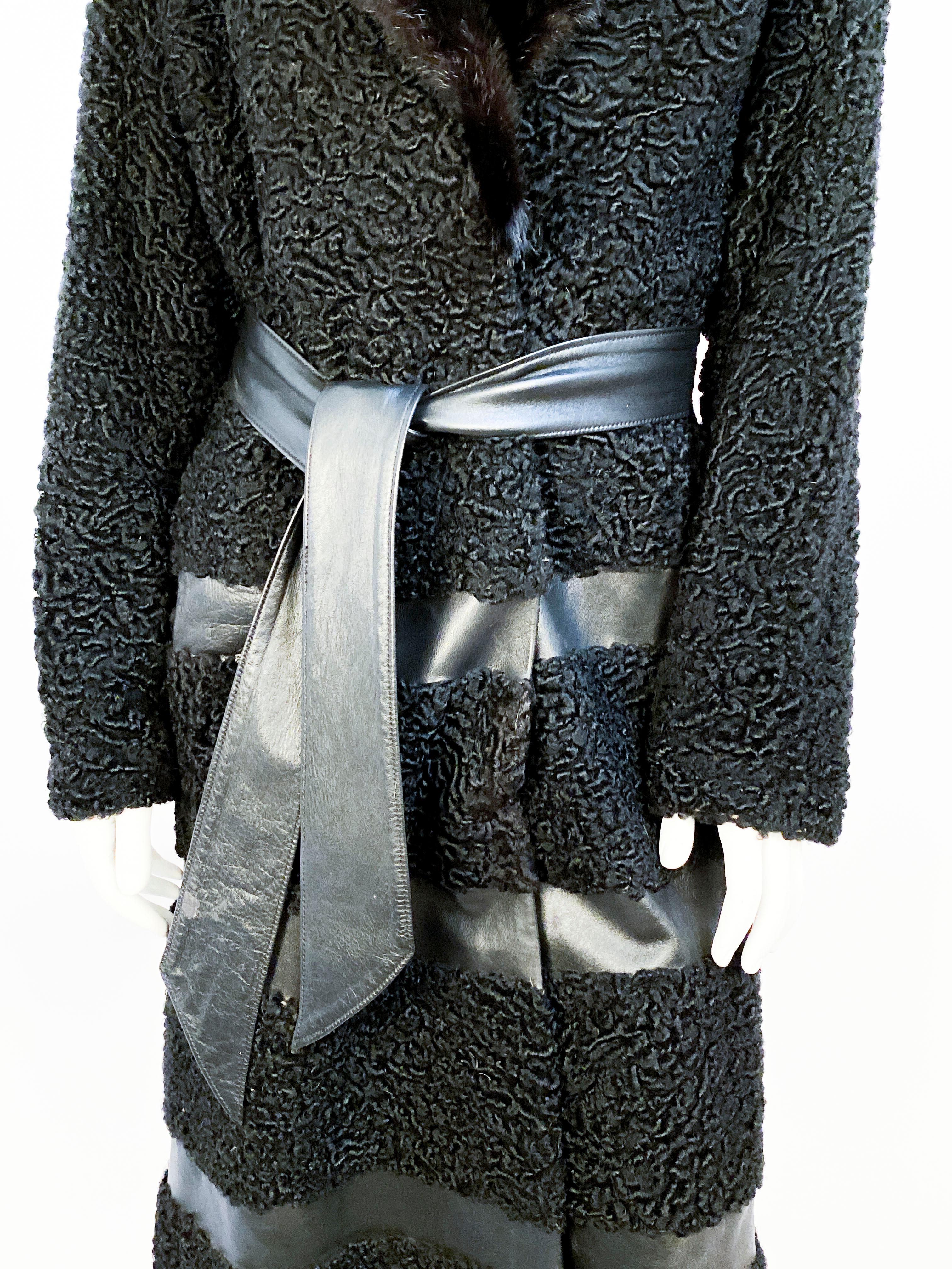 Late 1960s/Early 1970s Black Persian lab coat with bands of black leather and enlarged black mink collar. The body of the coat is lined with a checkerboard silk brocade lining