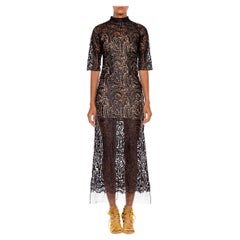 1960S Black Rayon Mesh
Appliqué Paisley Design Dress 1960S Black Rayon Mesh
Appliqué Paisley Design Dress