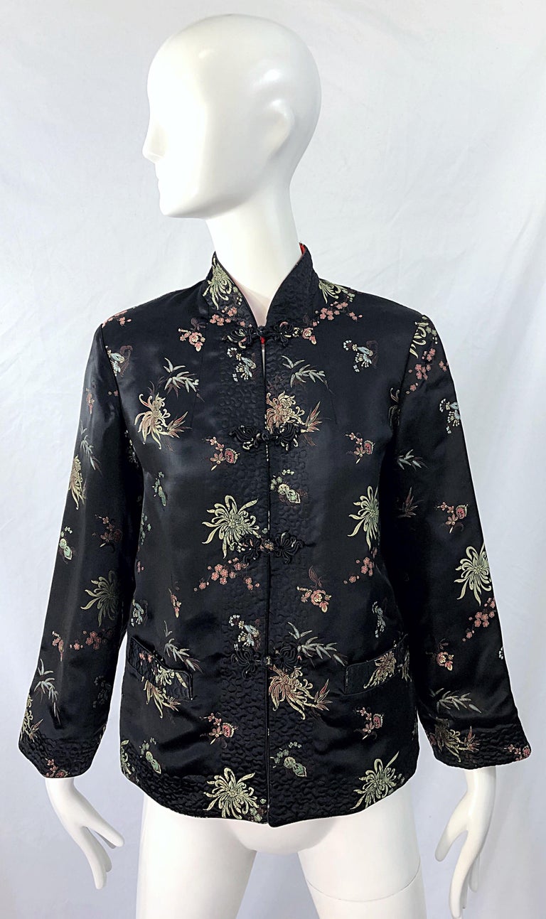 Chic 1960s Asian silk reversible jacket ! Features the softest black silk on one side, with the other side bright lipstick red. Toggle buttons down the center front on both sides. POCKETS at each side of the waist. Can easily be dressed up or down.