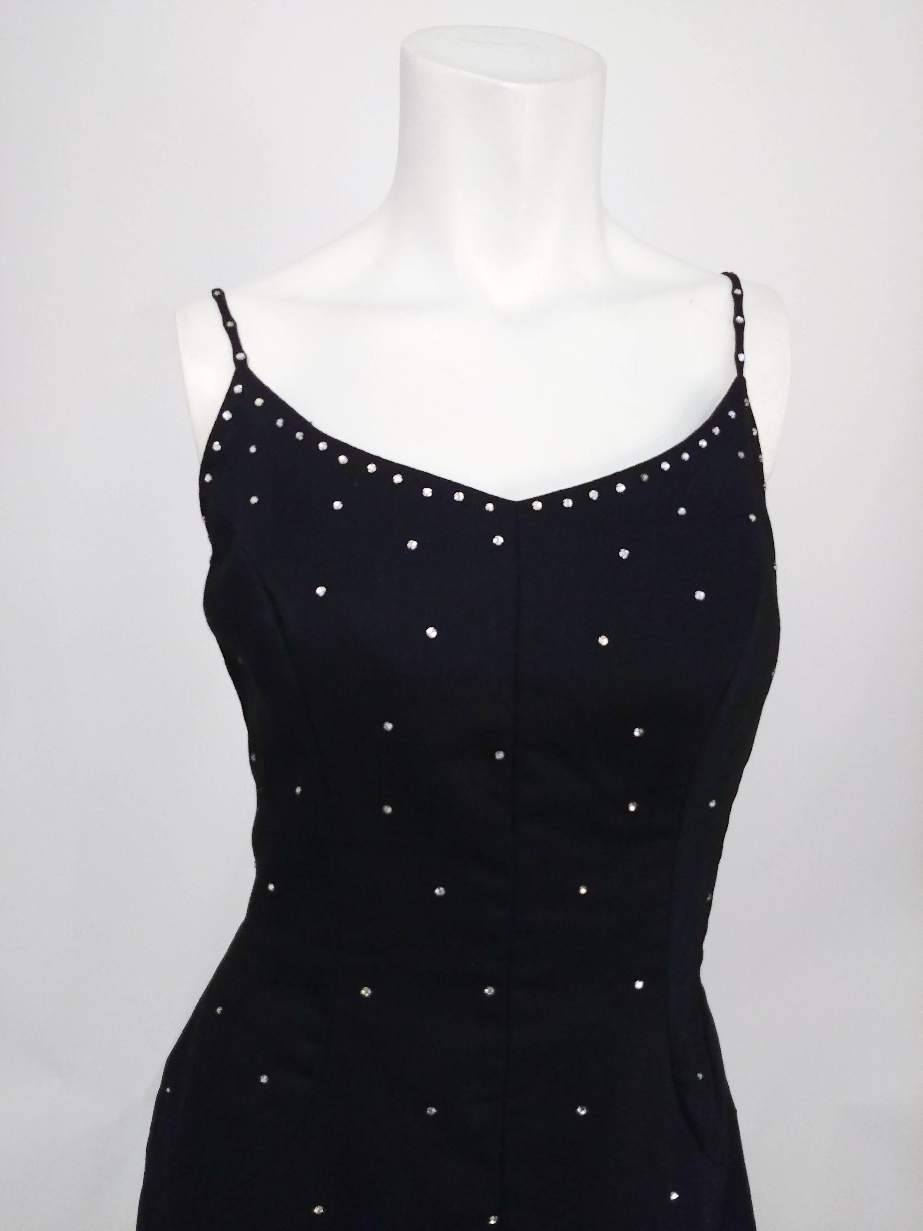 1960s Black Rhinestoned Cocktail Dress. Rhinestone detail at straps and graduating down to bottom. Pique fabric with some shine. Curved front slit. 
