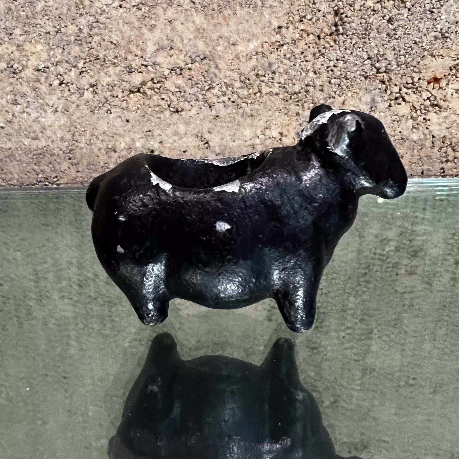 1960s Black Sheep Mini Planter Candle Holder signed 
Aluminum Painted Black signed art
3.25 d x 1.75 w x 2.25 h
Preowned unrestored vintage with wear and use. Minor losses.
Scuffs on the finish, wear around the edges.
Refer to images.