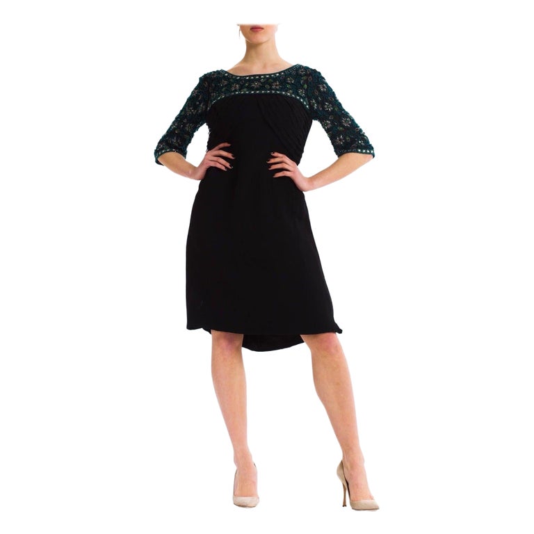 1960s Black Silk Mousseline Cocktail Dress With Emerald Crystal Beaded Sleeves 1960s Black Silk Mousseline Cocktail Dress With Emerald Crystal Beaded Sleeves