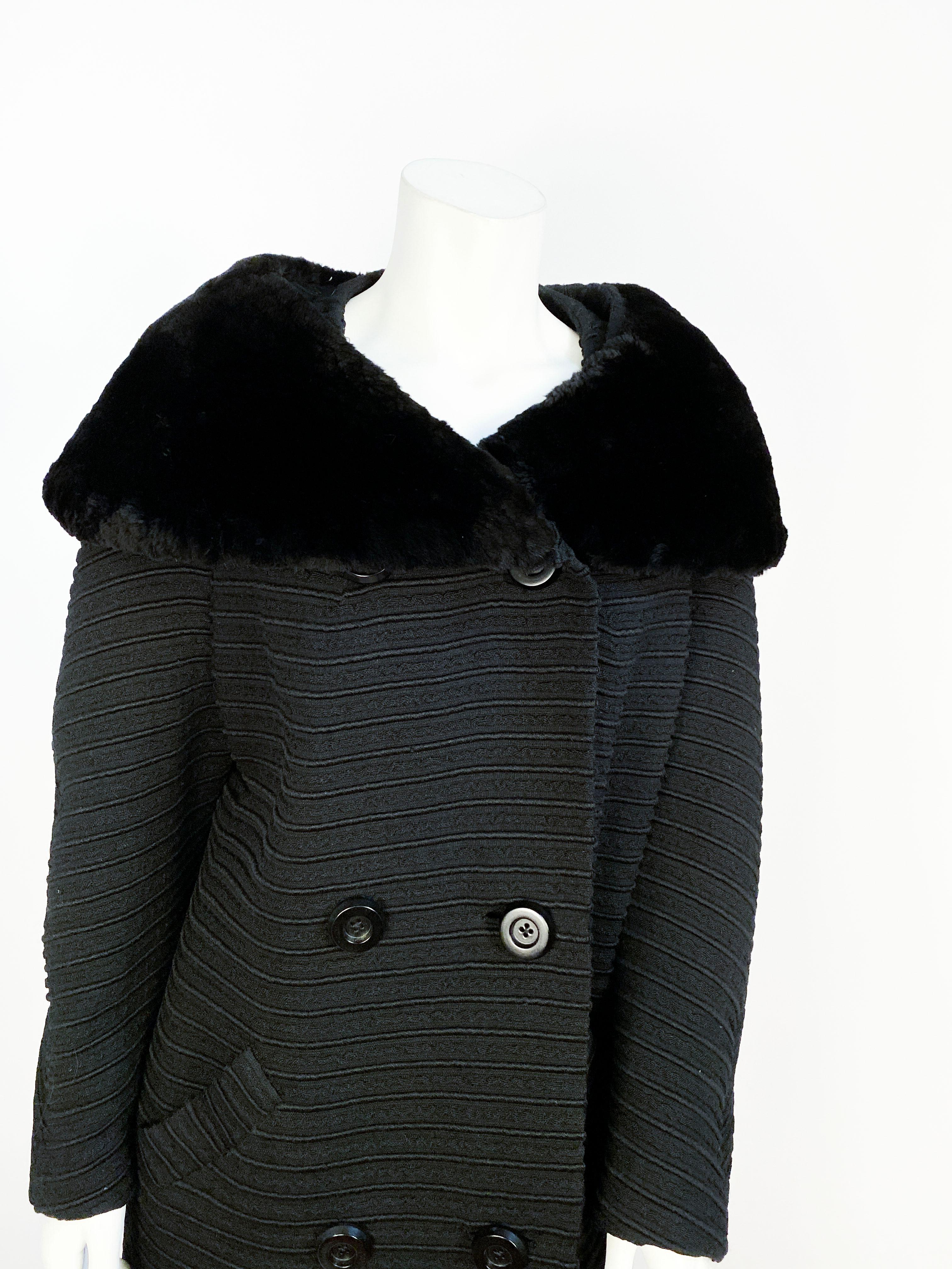 1960s Black coat made of textured ribbed wool finished with a sheared beaver collar.