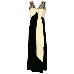 1960s Black Velvet Sleeveless Gown With Creme Silk Bow 1960s Black Velvet Sleeveless Gown With Creme Silk Bow