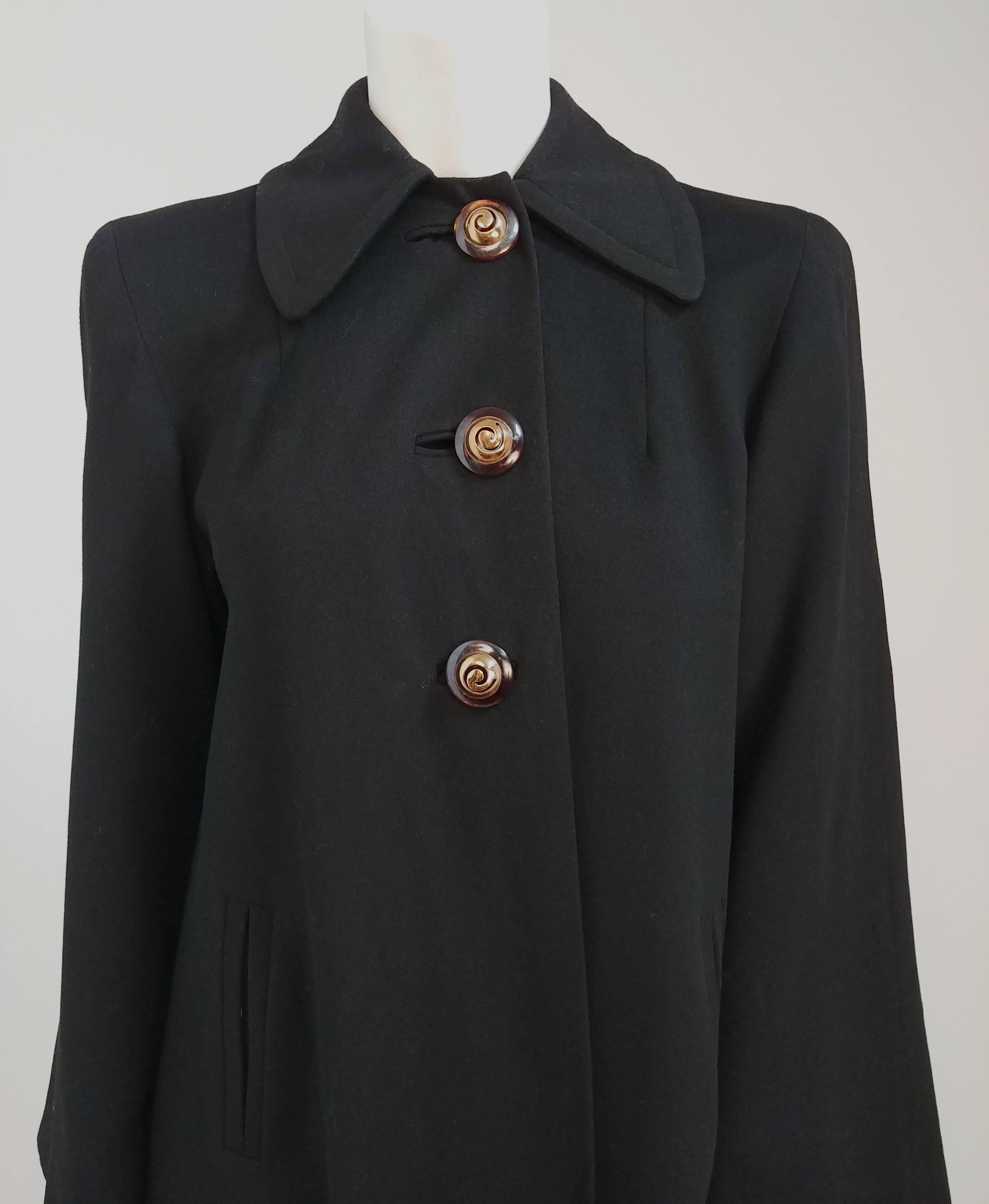 1960s Black Wool Coat w/ Gold Tone Buttons. Approx. US Size 6-8. Large decorative buttons in gold tone and classic 1960's collar. A-line silhouette. 