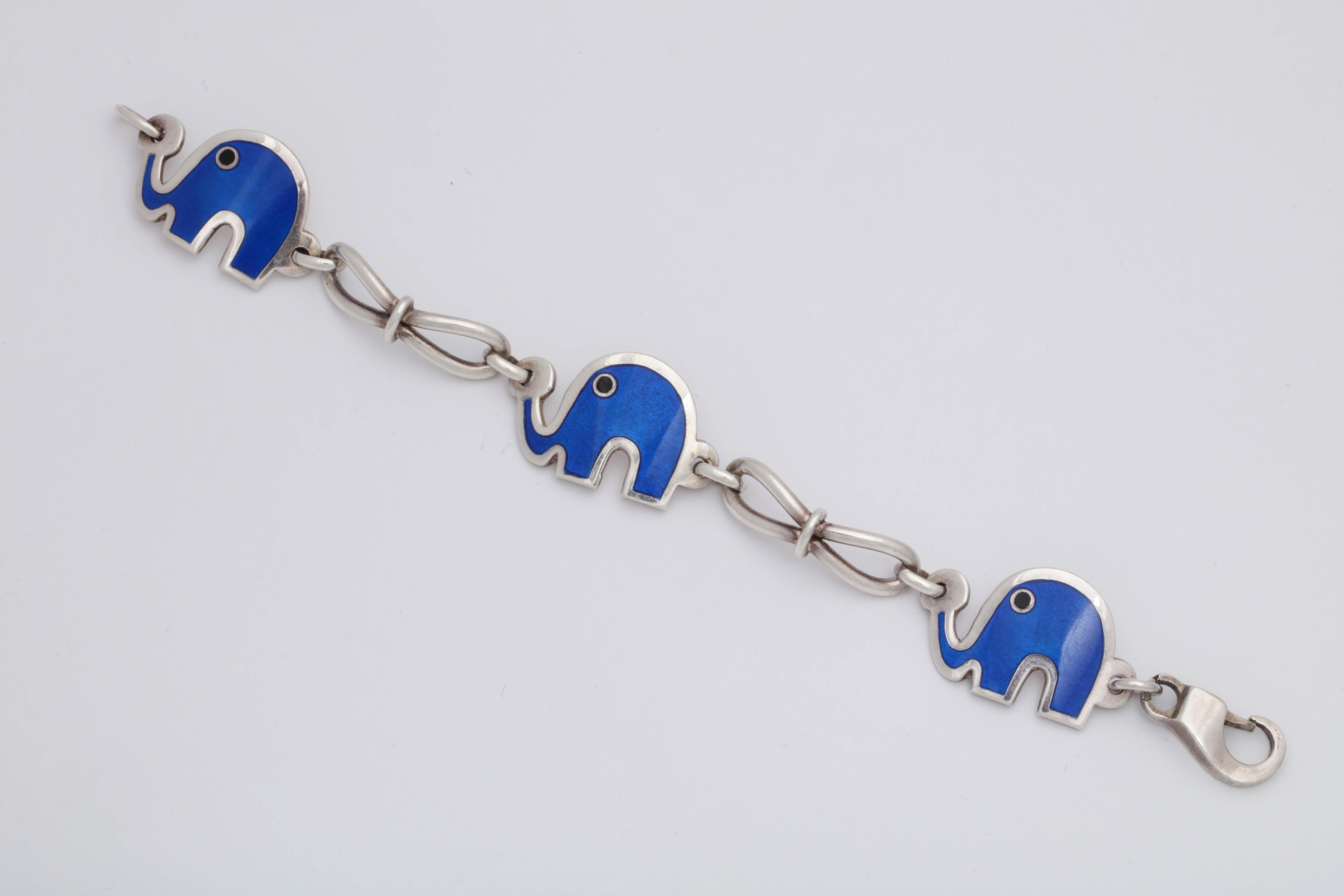 One Unisex Bracelet Designed With Three Figural And Whimisical Elephant Motifs Decorated With Blue Enamel And With Black Enamel Eyes. Created In Sterling Silver With A Fancy High Quality Lock. Made In The United States Of America In The 1960's.