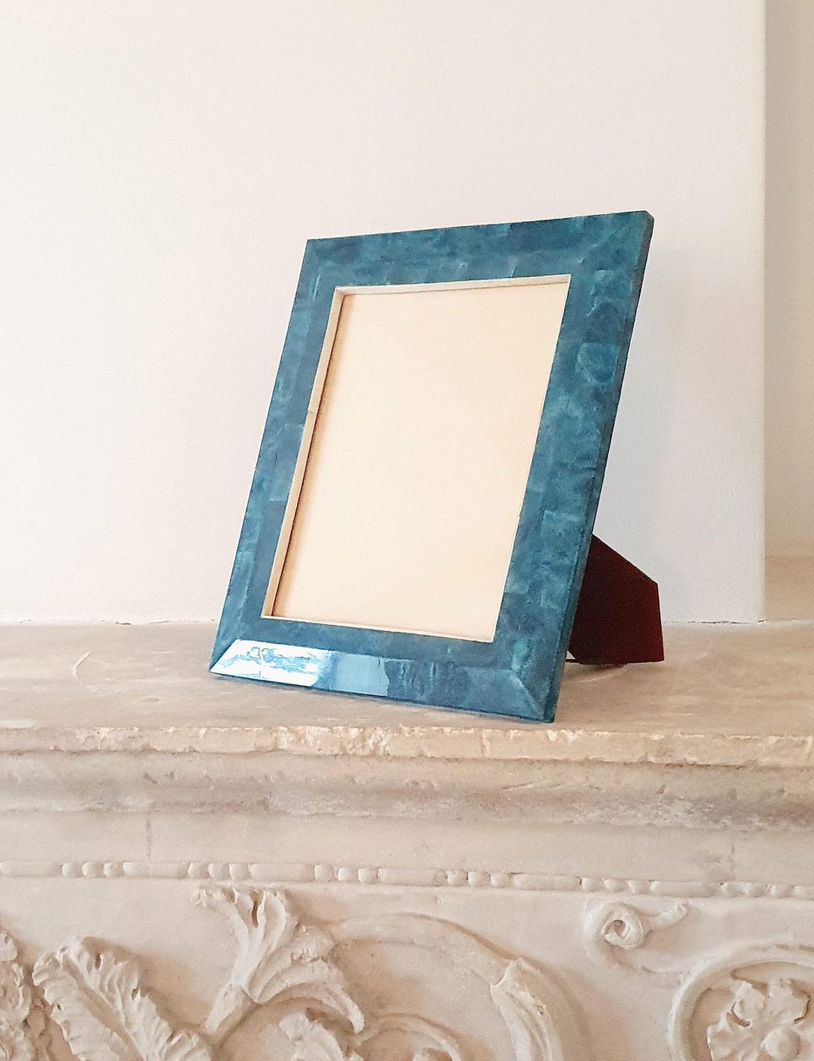 A 1960s handsome blue goat skin photo frame by the Italian designer, Aldo Tura. While his pieces were rarely signed, this piece has the design and technique that he used when making his furniture and accessories leading us to believe that it is his