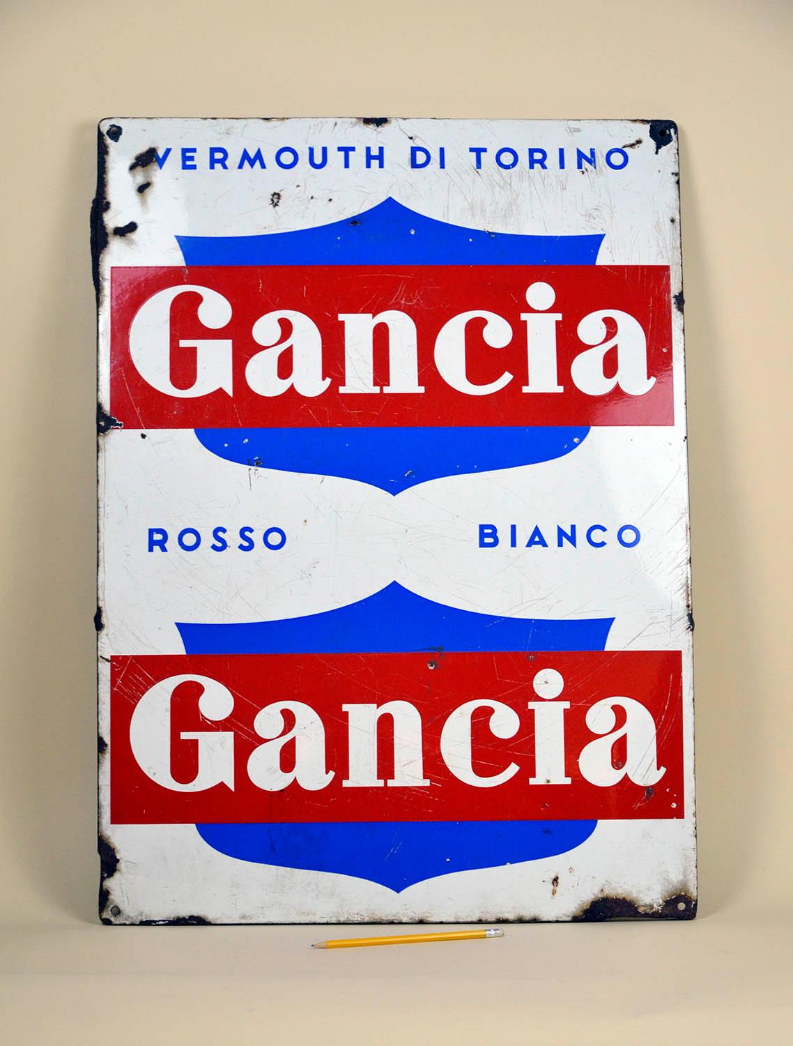 1960s enamel metal Gancia Vermouth sign with minor losses.
The sign present the company slogan 