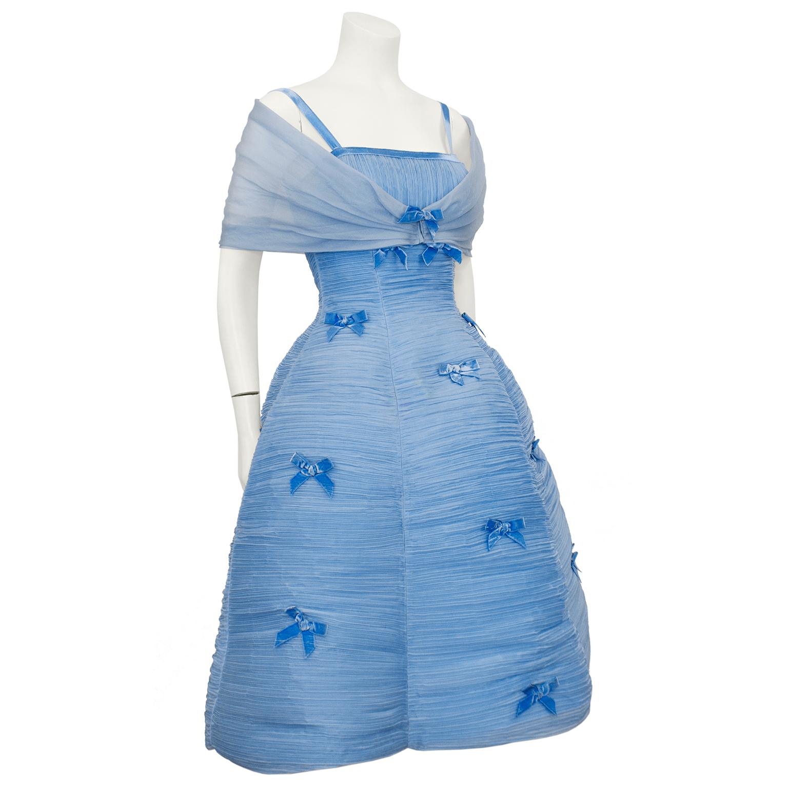 This 1960's baby blue pleated chiffon and velvet fit and flare dress appears to be the work of the Irish couturier Sybil Connelly however there is no longer a label inside. It belonged to a well known Toronto client who had many spectacular designer