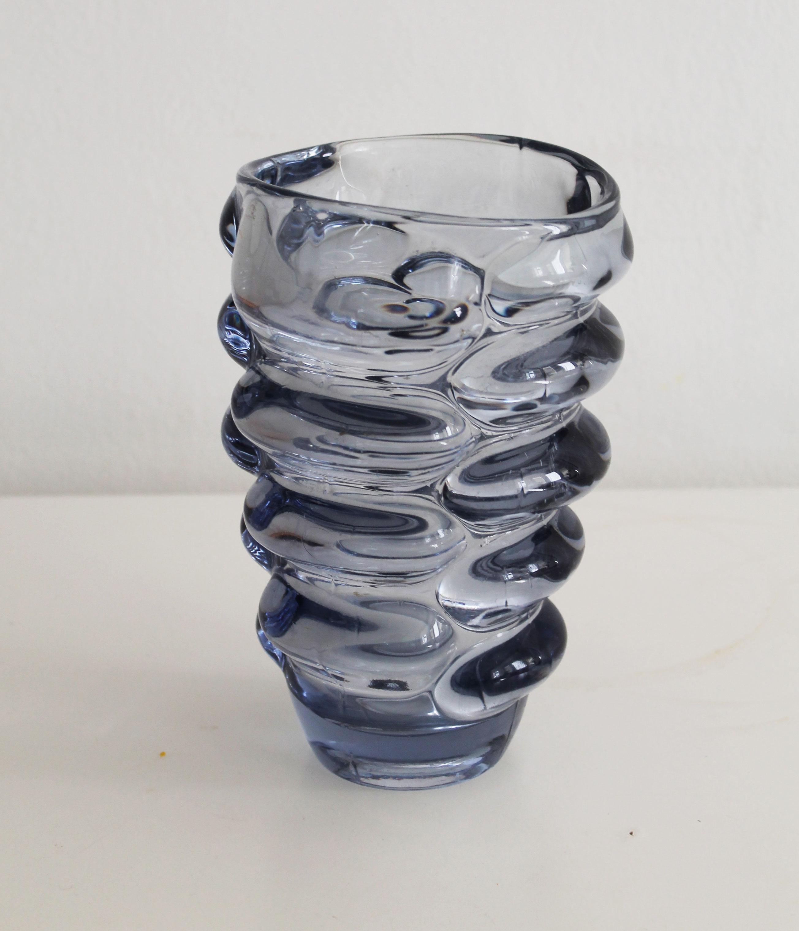 This is an original flower vase designed by Czech artist Vladislav Urban (1937-2022) and produced by Hermanova Hut Glasswork in the 1960’s.

Vladislav Urban was a talented and inventive glass artist working in the second half of the 20th century.
