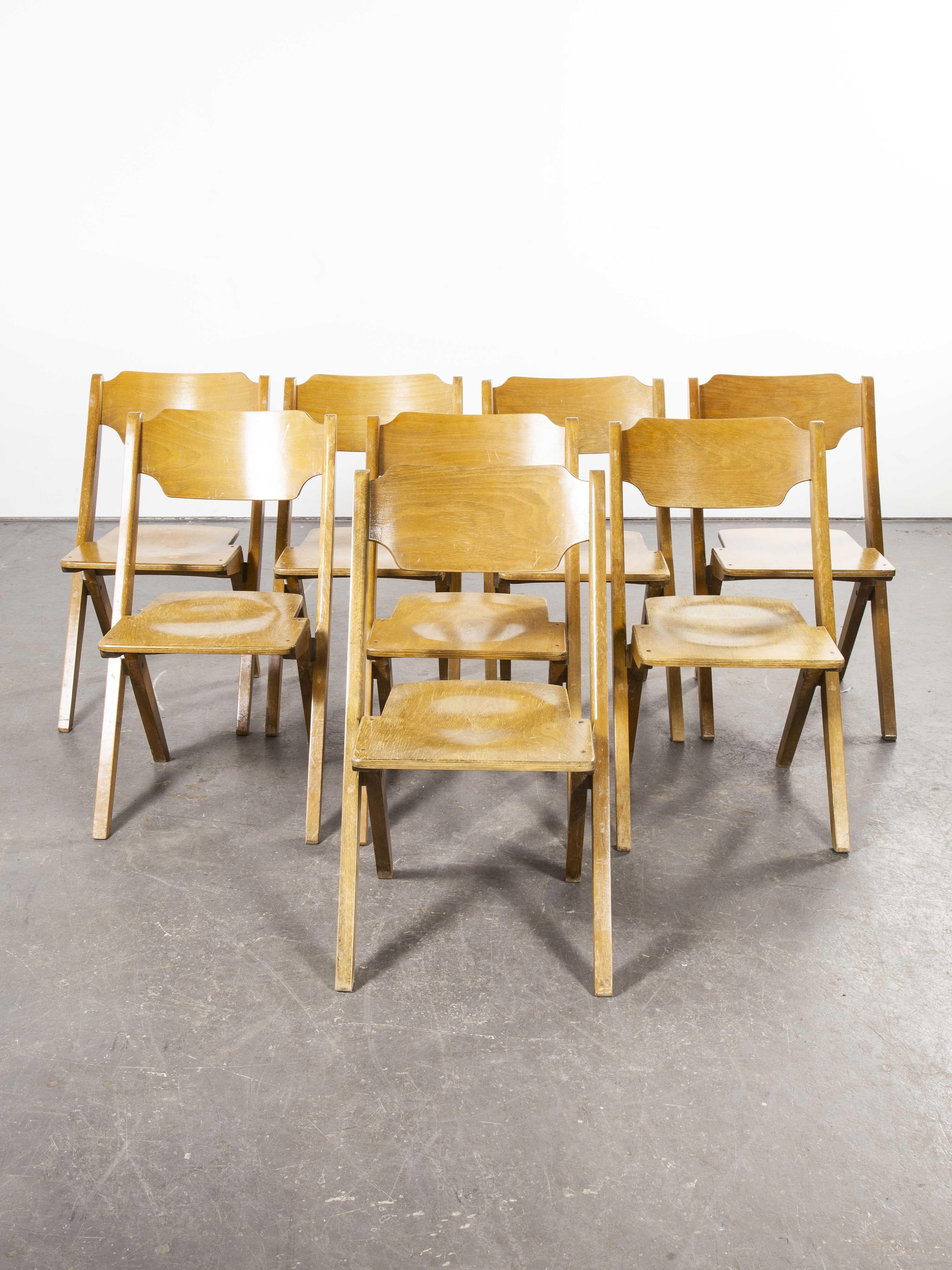 1960s Bombenstabil stacking beech dining chairs, set of eight

1960s Bombenstabil stacking beech dining chairs, set of eight. We believe these chairs were made by Bombenstabil in Germany in the 1950s. They have the aesthetic of a folding chair but