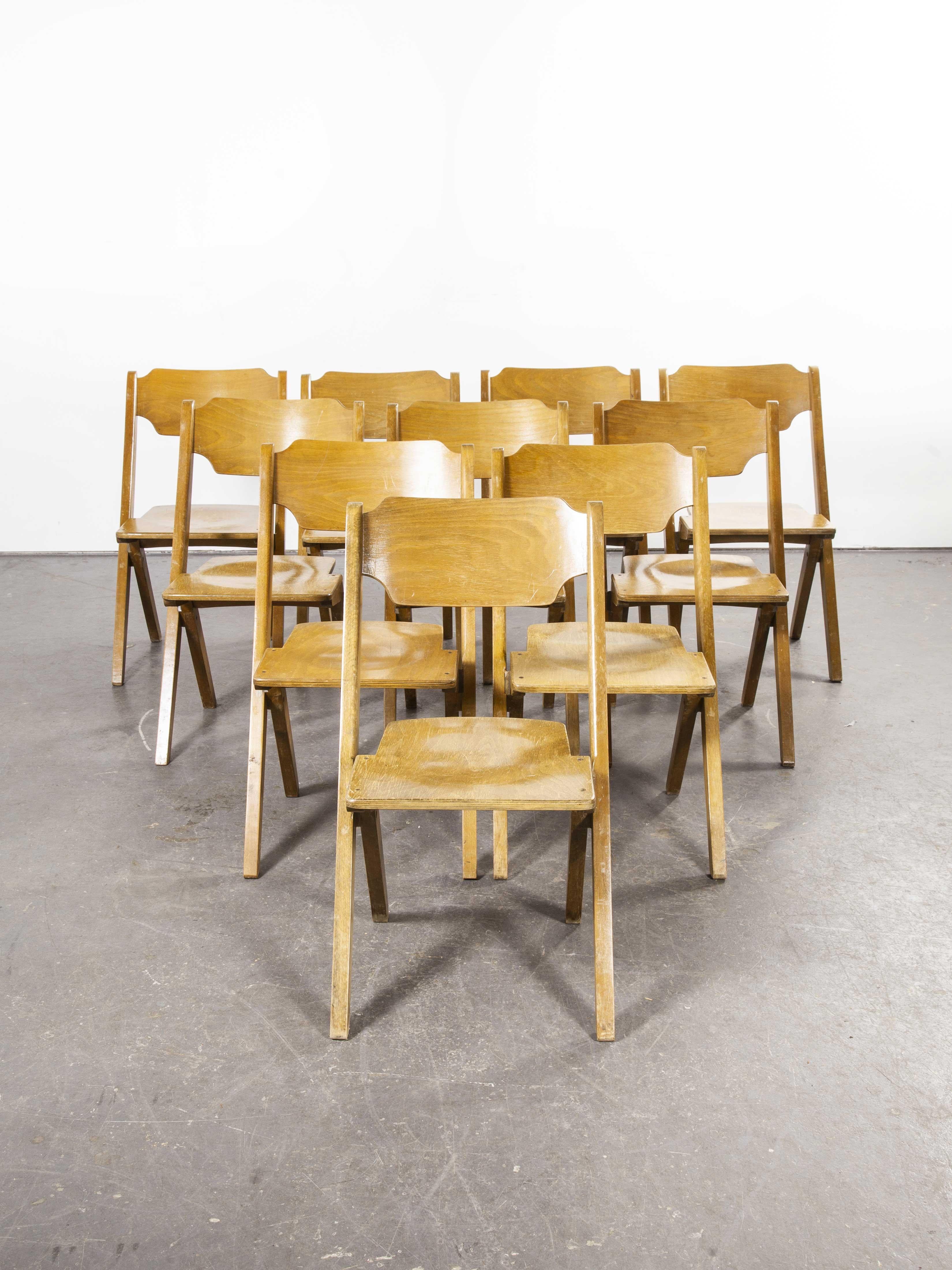 1960s Bombenstabil stacking beech dining chairs – set of ten. We believe these chairs were made by Bombenstabil in Germany in the 1950s. They have the aesthetic of a folding chair but they are rigid fixed chairs that by their design stack incredibly