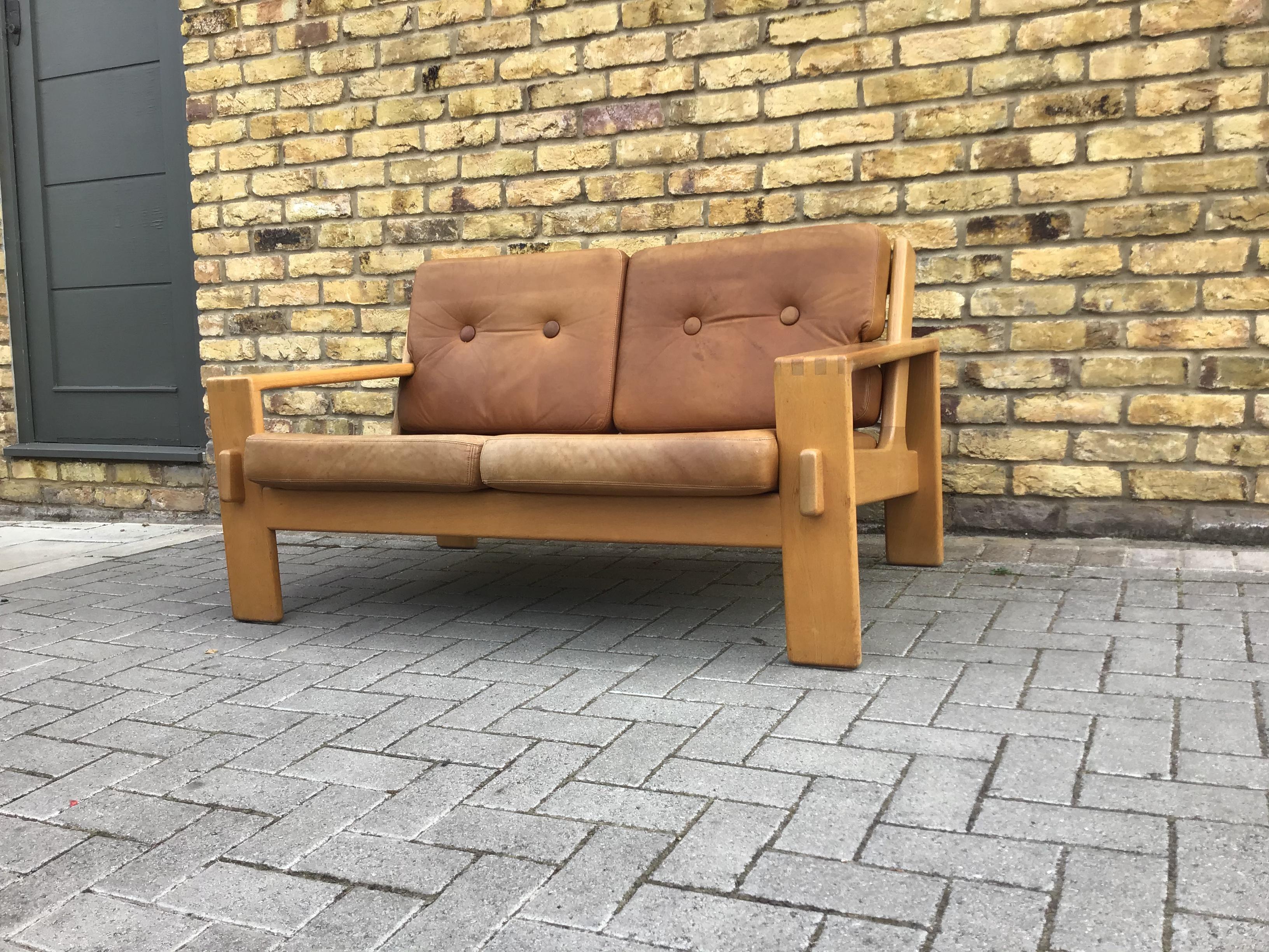 Two-seat sofa designed by Esko Pajamies for Asko Oak structure upholstered with original patinated soft brown leather .Remains in very good vintage conditions
circa 1960s Finland.