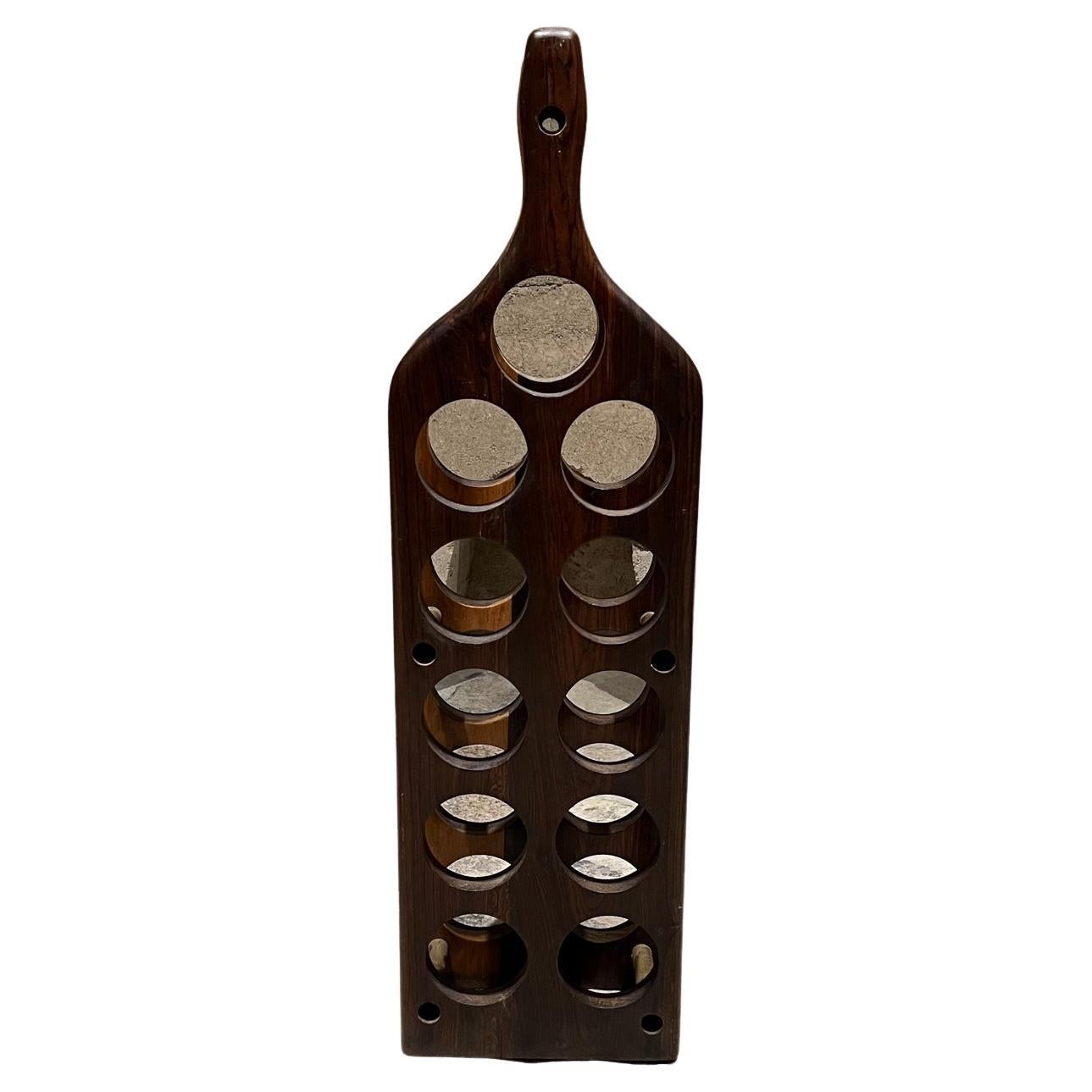 Wine rack
11 bottle exotic wood wine rack in the shape of a wine bottle.
Attributed to Don S Shoemaker. Mexico 1960s.
Unmarked
Designed in rosewood brass and Cocobolo wood.
Rack can hold up to eleven (11) bottles. It is connected by brass