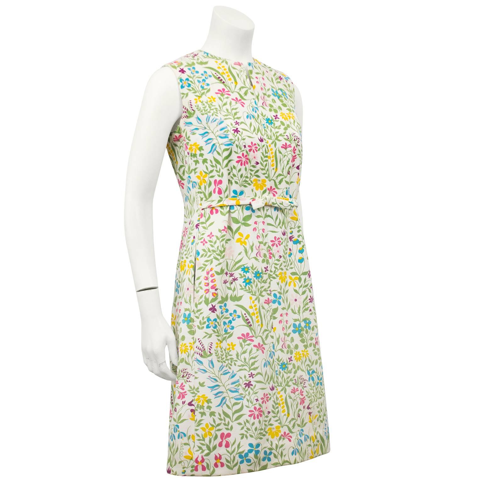 Cute as a button 1960s Boussac of France cotton day dress from the 1960s. Best known for the Pierre Frey printed cotton fabrics these Boussac dresses are collectible, timeless and fun to wear. Stunning bright floral print on a cream background.