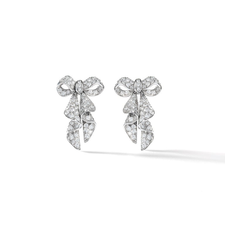 Bow design Diamond and Platinum Earrings. 
Circa 1960.
Numbered.

Total height: 1.18 inch (3.00 centimeters).
Width at maximum: 0.67 inch (1.70 centimeter).


Former collection of a French Lady.

We are reknown for curating unfindable jewels.
Most