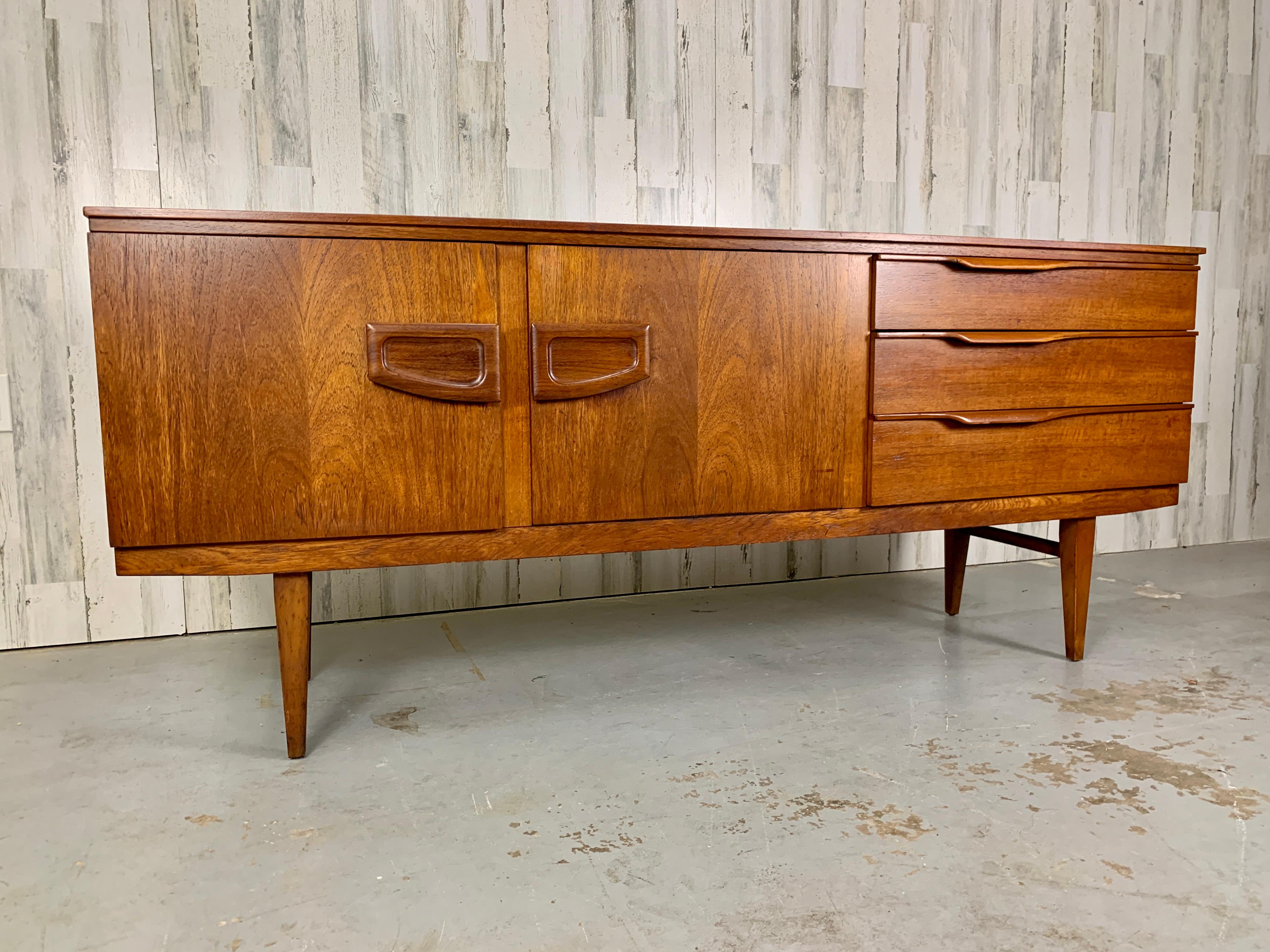 English 1960s Bow Front Teak Credenza For Sale