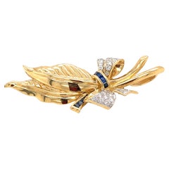 1960s Bow Leaf Pendant Brooch with Diamonds and Sapphires in 18 Karat Gold