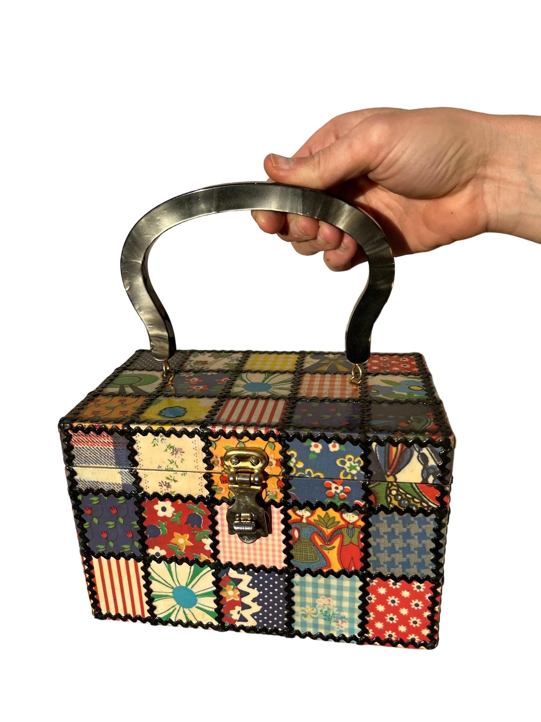 1960s Box Purse Patchwork Decoupage w/ Lucite

Amazing hand-collaged 1960s patch-work box purse is decoupaged in varying 60s-70s patterns. Each square is trimmed with ric-rac. It has a gorgeous silvery-gray marbled lucite handle, metal clasp &