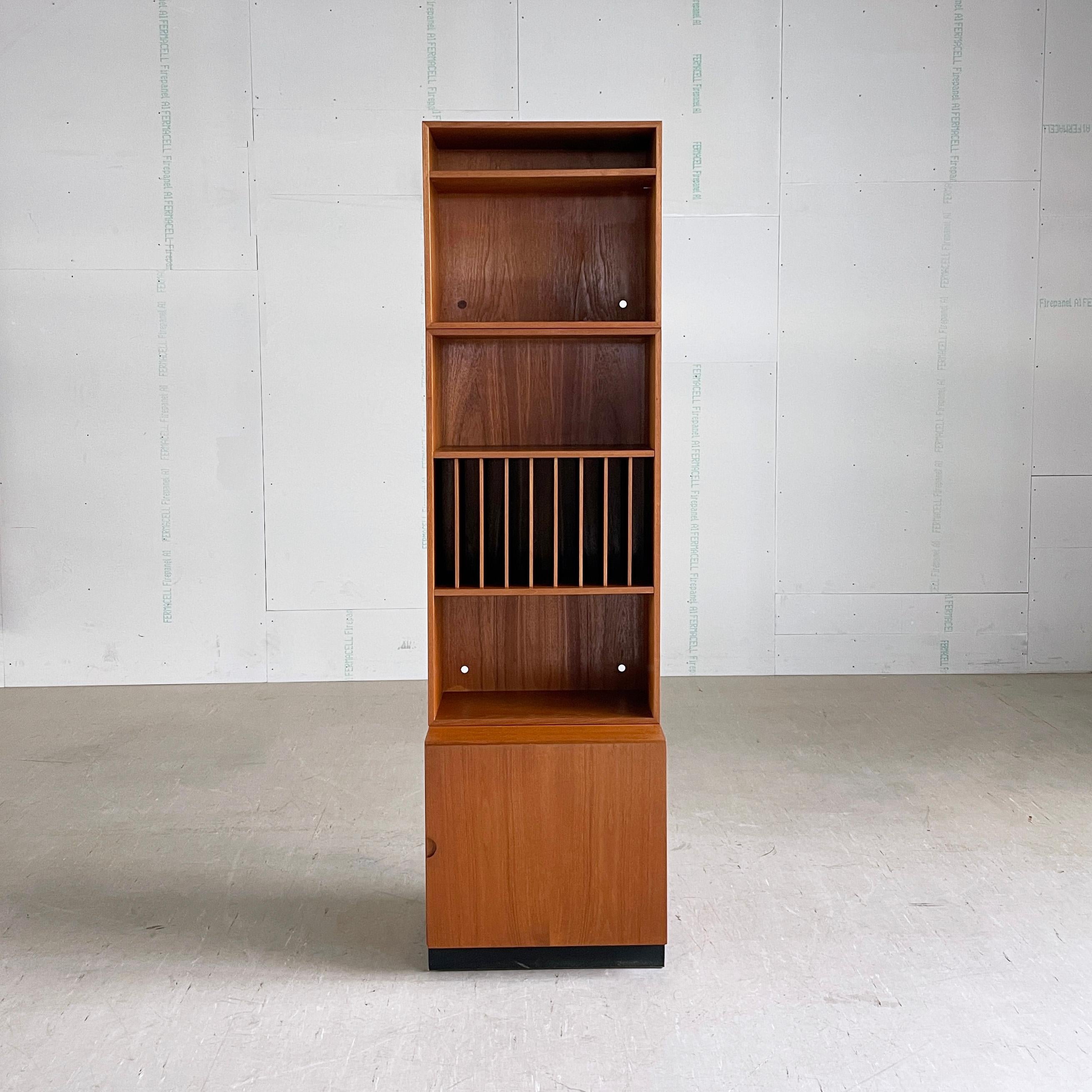 1960’s Bramin ‘System 160’ modular stereo cabinet / storage system. Designed by Sven Ellekaer, Denmark. Consists of three separate stackable units with teak veneer. Upper module with one height adjustable shelf. Middle section with LP rack and two