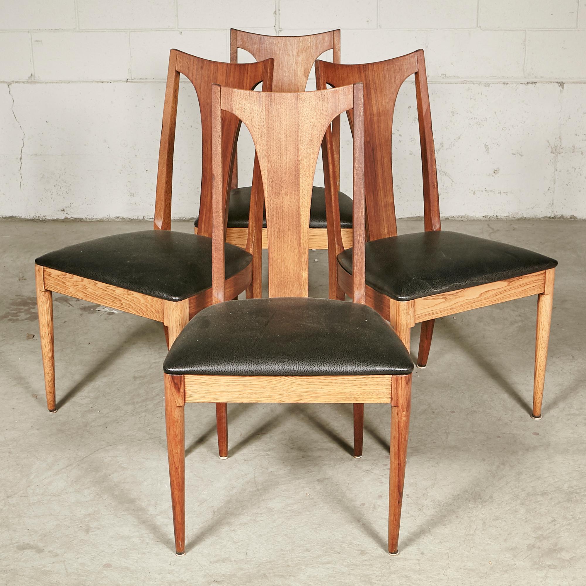 Vintage 1960s set of 4 walnut wood high back Brasilia-style dining room chairs. Chairs are in newly refinished condition. Seat: 18.5in.H. No maker's mark.
               