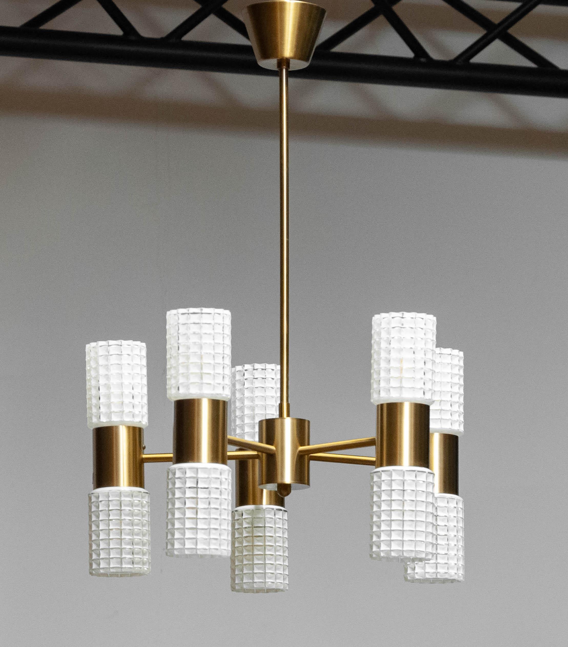 Beautiful high quality brass and art glass chandelier attributed to Hans-Agne Jacobssen for Markaryd AB, Sweden
It consists five arms with two white glass shades each which ( upper and lower ) can be switched separately. Ten E14 screw