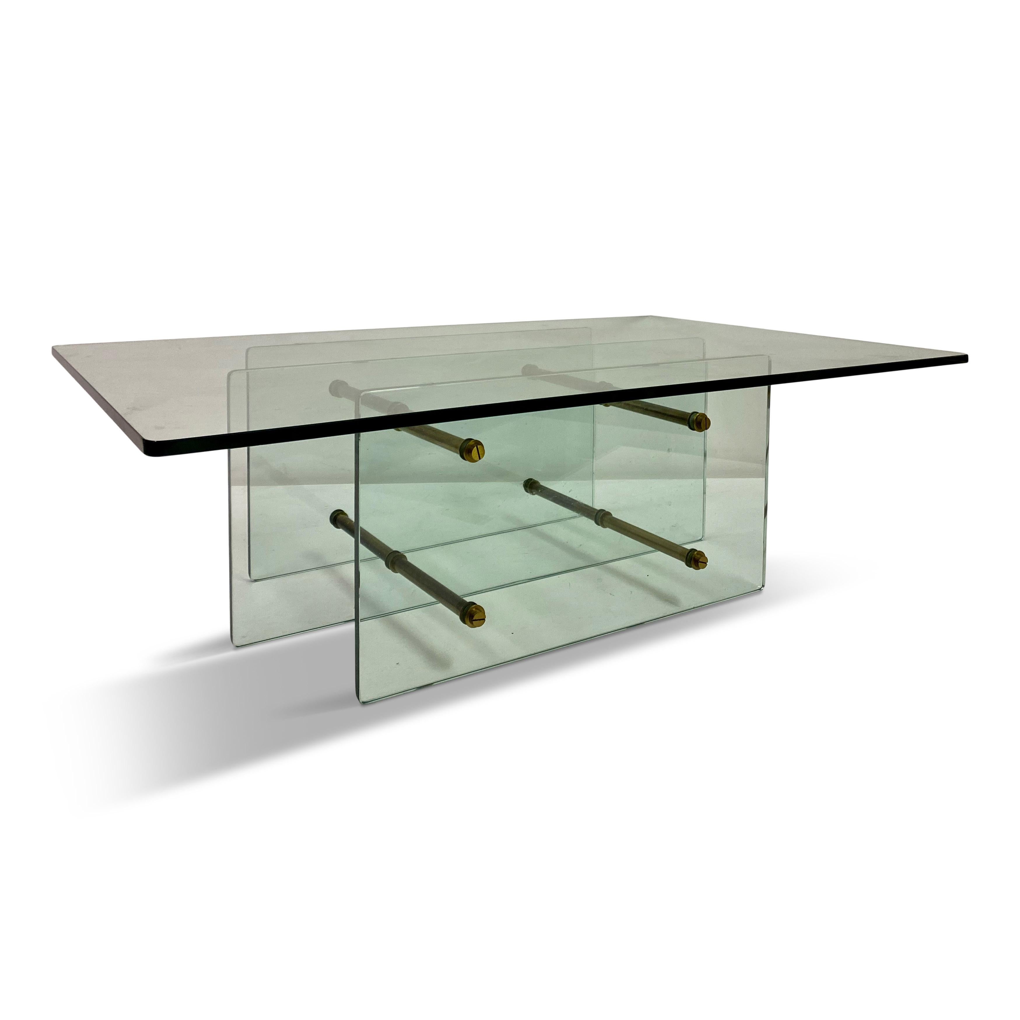 Coffee table

Attributed to Fontana Arte

Thick glass sections

Brass rods holding it together

1960s Italy.