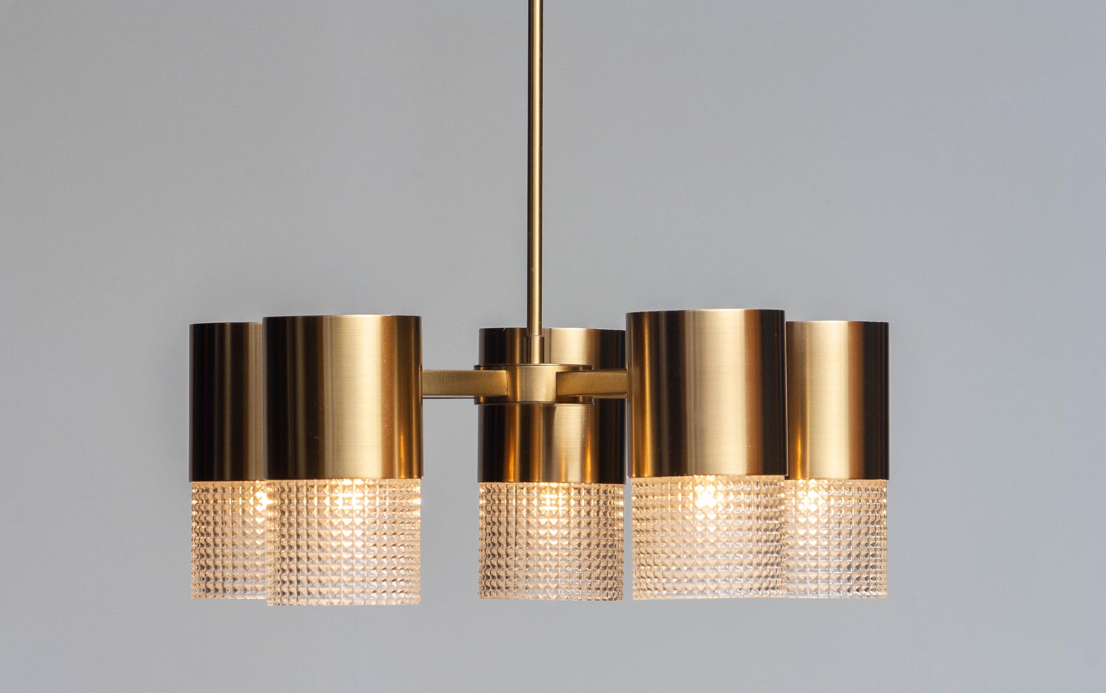 Beautiful Scandinavian cylindrical chandelier by Konsthantverk Tyringe in Sweden in brass. 
The cylinders can be, when liked, together or separately switched, in a set of two and three, on / off.
Technically 100% and in overall good