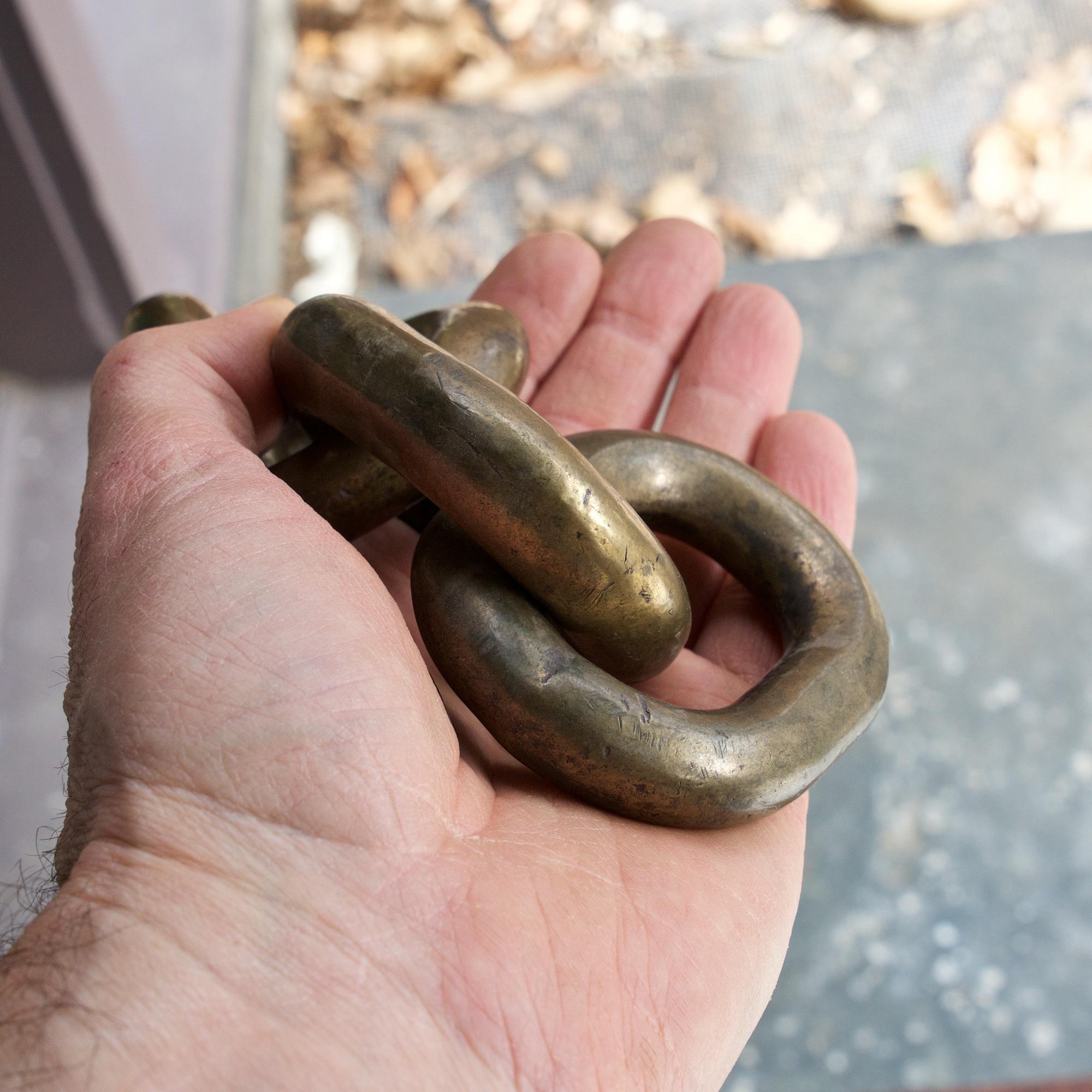 Giant 1960s brass chain link paperweight. Beautiful and solid piece, good weight, 2lbs. 5.3oz. No makers marks. Presented in unpolished, original finish.